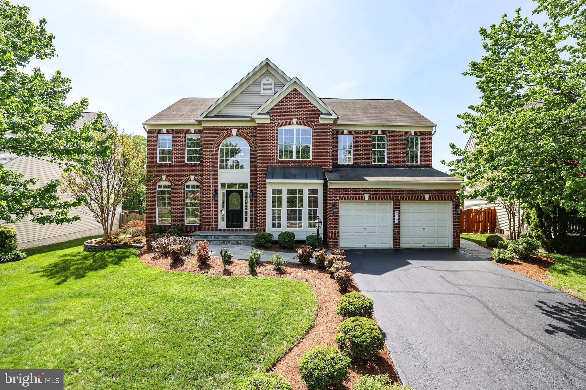 Welcome Home to Ashbrook! This beautifully updated, original-owner home offers the perfect blend of comfort, style, and convenience. Ideally positioned to enjoy morning sun and stunning evening sunsets, this East/Northeast-facing gem is located just minutes from Rt. 7, Rt. 28, Dulles Airport, and all the shopping, dining, and entertainment of One Loudoun.

Step inside to discover beautiful hardwood floors, modern lighting, brand new carpet, fresh designer paint, and stylish upgrades throughout. The main level features a light-filled two-story foyer, a private office with French doors, and a stunning kitchen with new quartz countertops, stainless steel appliances, deep undermount sink, and recessed lighting—all open to a spacious family room warmed by a cozy gas fireplace with raised stone hearth.

Upstairs, the expansive primary suite is your personal retreat with its own gas fireplace, sitting area, large walk-in closet, and spa-like bath with updated gold fixtures and lighting. Three additional bedrooms and a shared full bath with double vanity complete the upper level.  The large laundry room is located on the upper level for added convenience.  

The fully finished basement is perfect for entertaining, featuring a full wet bar, recreation area, and a home gym or optional 5th bedroom with a full bathroom—ideal for guests or extended family. A large storage room provides plenty of space for seasonal items.

Enjoy the privacy of a lush backyard that backs to wooded common area, and a freshly painted two-car garage with epoxy floors. Don’t miss this turnkey home in a prime Ashbrook location, a small community of beautiful homes whose amenities include a community pool, walking path that encircles the community and a tot lot/playground for the little ones!

Updates include upper HVAC replaced (2018) and lower HVAC replaced (2021), and just completed (April 2025):  newly finished hardwood flooring, new quartz counters, stainless steel sink, lighting, fresh paint throughout, new carpet upstairs, painted and epoxy floor in garage, new stain on entire fence)