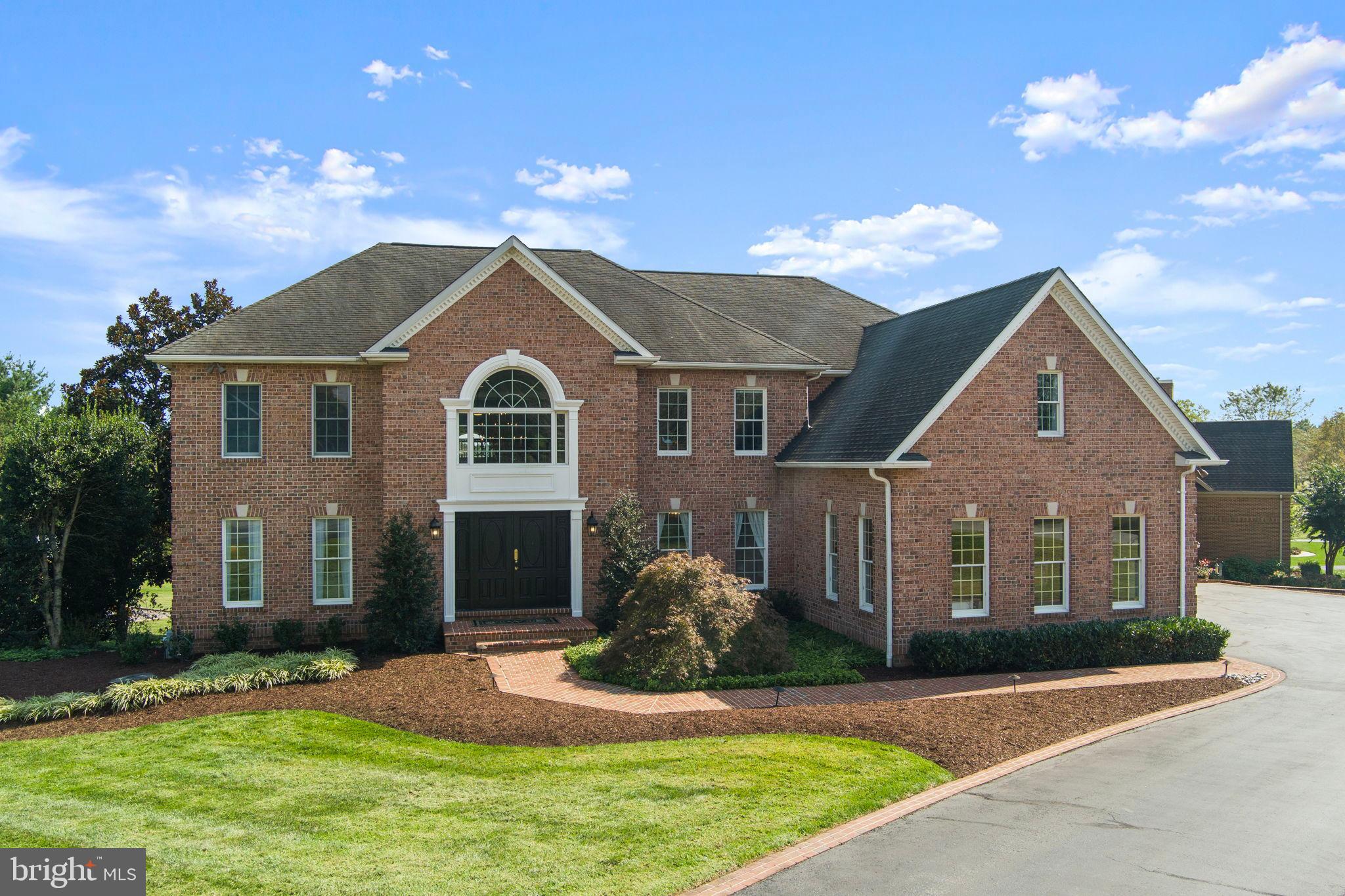 We invite you to visit Willow Birch Estate, a stunning brick home in the Cattail Creek community, now offered at $1.699M. Don’t miss your chance to own more than 7,500 sq ft of finished living space on a professionally landscaped acre-plus corner lot!

A sweeping circular drive, brick-paved walkway, and double-door entry lead into a dramatic two-story foyer with a grand dual staircase and chandelier. The main level showcases cherry oak hardwoods, marble flooring, custom millwork, and built-ins — all creating timeless elegance.

The chef’s kitchen features Viking appliances, multiple beverage centers, custom cabinetry, and open sightlines for both entertaining and everyday living. Just off the kitchen, the sunroom with a second gas fireplace offers a warm, inviting space year-round. A grand family room with soaring ceilings, walls of windows (including a recently replaced picture window), and a fireplace anchors the heart of the home. The formal dining room, enhanced with a tray ceiling and cove lighting, adds to the grandeur.

The primary suite is a true retreat with a custom coffered ceiling and a spa-inspired bath featuring a free-standing Kallista tub, body jet shower, dual vanities, and an in-suite washer and dryer. Each additional bedroom includes a walk-in closet with custom built-ins and an en-suite bathroom for ultimate comfort and convenience.

The fully renovated lower level offers a flexible bonus room (potential 7th bedroom), recreation areas, guest accommodations, and new LVP flooring. Additional upgrades include a new HVAC system, water heater, upgraded sump pump, instant hot water and soft water filtration systems, whole-home humidifier, and extensive exterior drainage system.

Outdoor living impresses with a deck, lower-level patio, private play area, shed that conveys, and basketball hoop. The three-car side-load garage and circular driveway provide parking for 10+ vehicles. Owned solar panels further enhance efficiency.

Located within walking distance to Cattail Creek Golf Club, residents enjoy effortless access to golf, dining, and social amenities — all within one of Howard County’s most sought-after school districts.

This is more than a home — it’s a rare opportunity to own a distinguished estate that blends architectural sophistication, modern upgrades, and resort-style living in one of Maryland’s most coveted communities.