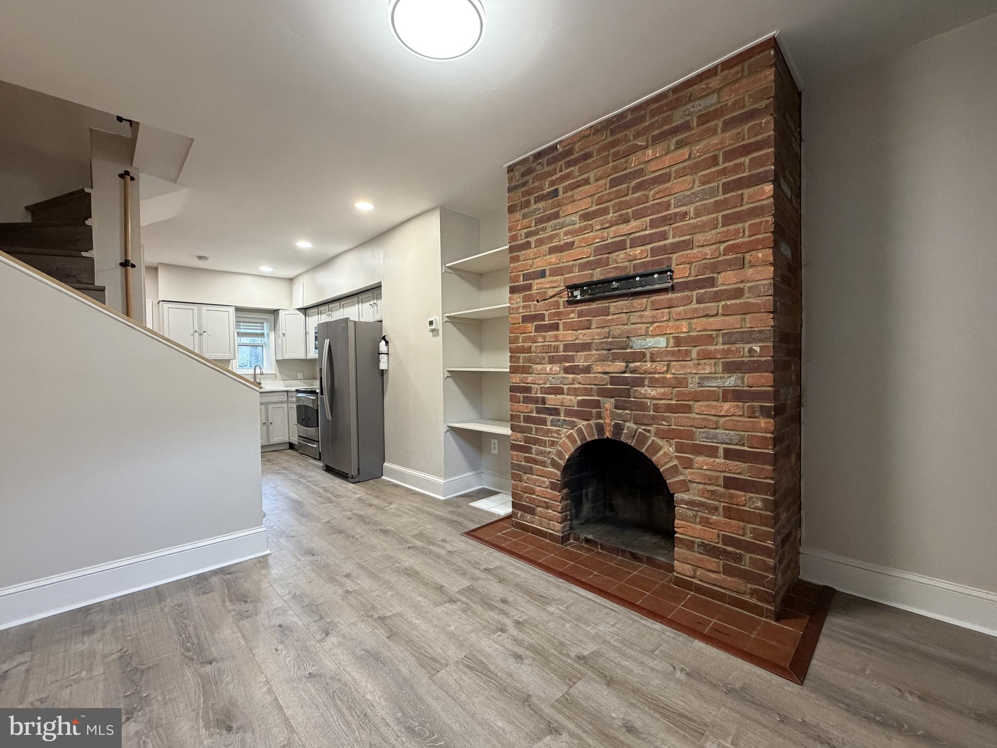 Beautifully renovated brick-front townhouse in the heart of Washington Village/Pigtown! This move-in ready home features a brand-new kitchen and beautifully updated full bath, blending modern finishes with Baltimore charm. Currently configured as a spacious one-bedroom, one-bath residence, the open-concept main level offers a bright living area, dining space, and stylish kitchen complete with stainless steel appliances, modern cabinetry, and ample workspace. Additional highlights include exposed brick, recessed lighting, new flooring, central air conditioning, forced-air heat, upper-level laundry, and an unfinished basement providing excellent storage space. Ideally located just minutes from Downtown Baltimore, the Inner Harbor, Camden Yards, M&T Bank Stadium, the University of Maryland Medical Center and BioPark, Hollins Market, Lexington Market, Cross Street Market, Federal Hill, I-95, I-295 and so much more! Whether you're searching for your first home, a low-maintenance city residence, or an investment opportunity, this turnkey property offers exceptional value in one of Baltimore's most convenient & growing neighborhoods.