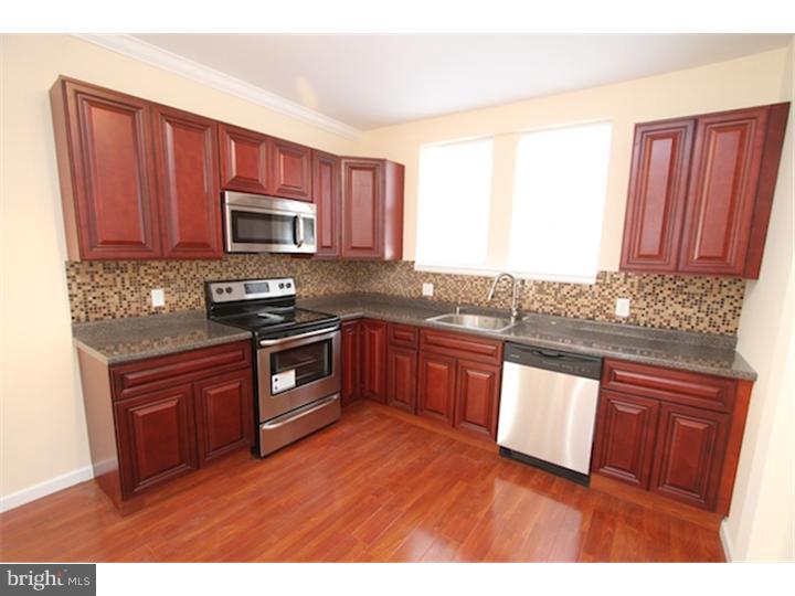 Elegance, Luxury, and Pristine are the right words to describe this 3-bedroom 2-bathroom home located in West Oak Lane! Situated on a gorgeous block with an open porch, this home has updates in all areas! There is an open floor plan concept, which leads to a beautiful Brazilian Cherry kitchen, which features all new appliances.  Also all new flooring has been added throughout! Some extra features include a full finished basement that is also a walk out has a full bath of its own! All bathrooms in the home feature new tile work and fixtures! This home is truly a must see!