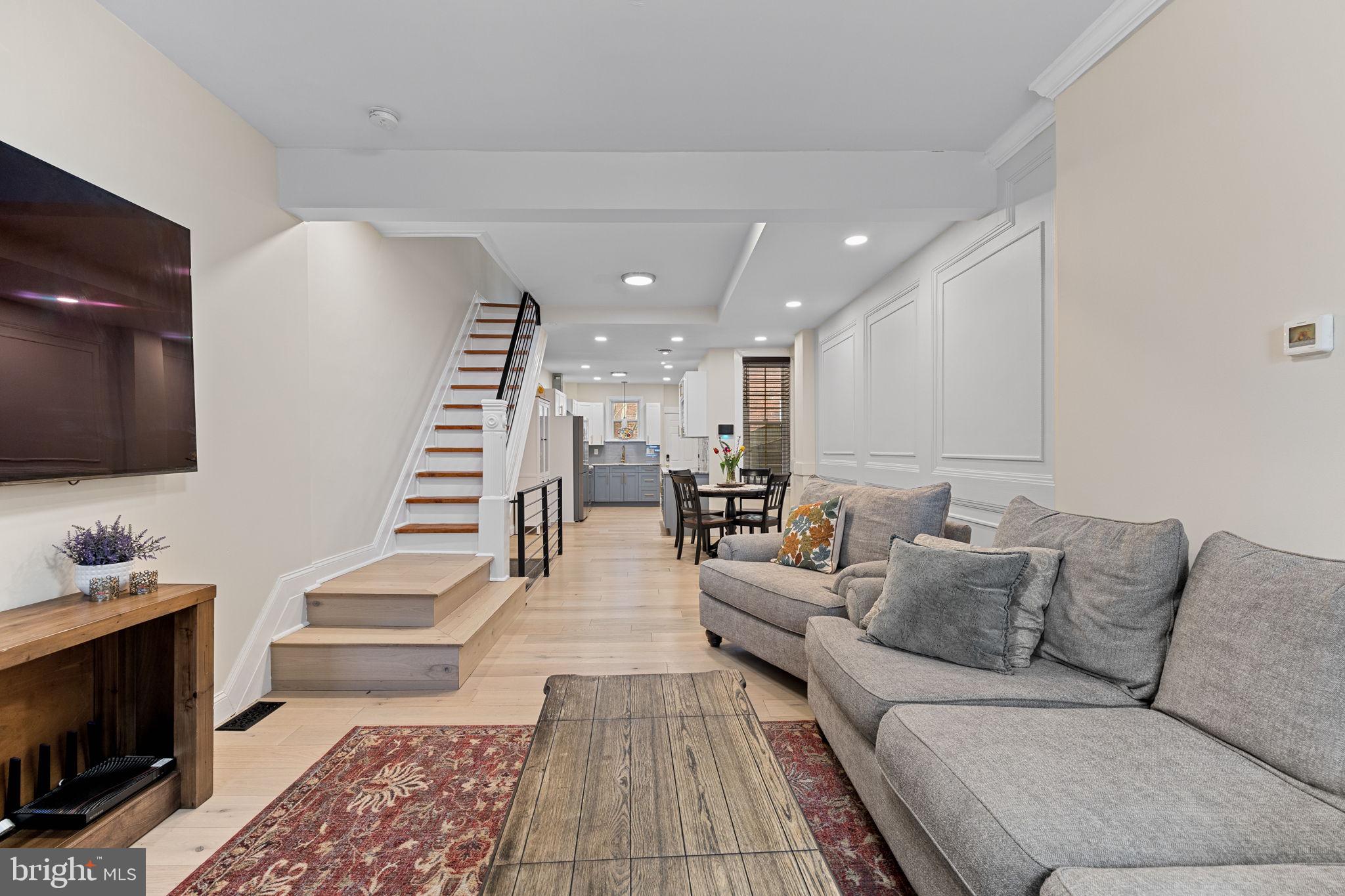 Introducing 902 N. 29th Street! Enter to an oversized living room, with ample room for an oversized couch and chair. The hardwood floors and traditional wood molding impress immediately as you pass through the dining area into a modern, and oversized kitchen with upgraded stainless appliances. My favorite part of this home may be the rear patio and large backyard. It’s quiet and private. Also, don’t miss the convenient alley access which allows you to avoid carrying your trash through the house.
The second level is highlighted by two bedrooms and two full baths. They’re even bigger than the photos seem to show. The third floor offers an additional bedroom suite and bath. It’s also easy to miss the full, finished basement. It’s a flexible space with lots of storage — even has a half bath. This impressive home is only two blocks from Lemon Hill at Fairmount Park, two blocks from The Boozy Mutt (Pennsylvania’s first indoor-outdoor off-leash dog bar), and one-half mile from the Philadelphia Museum of Art! Convenient to SEPTA, I-76, and Center City Philadelphia. Visit an open house this weekend or schedule your private showing today!