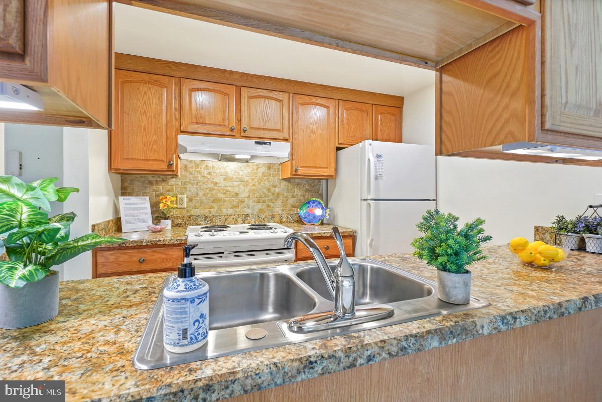 Back on the market!  Previous buyer cannot complete the purchase.  Their loss is your gain!  Gated 55+ Active Adult Community. Beautiful eastern exposure with scenic Broadwalk/walking trail views from this light and bright terrace-level 1-bedroom “Staunton” model in Montgomery Mutual. Enjoy easy access to the patio through the sliding glass door from the Living Room, creating a peaceful indoor-outdoor living experience. This move-in ready home features a remodeled kitchen, updated bath with step-in shower, fresh paint, new carpet and vinyl flooring, and has been professionally cleaned and is ready for its next owner.  Convenient first-floor access directly from the left-side parking lot with no steps and a straight path into the building. Additional features include an assigned parking space, storage cage, and shared laundry just across the hall.  Monthly fee includes both Co-op and HOA fees, all utilities, basic cable TV, Wi-Fi, property taxes, most unit maintenance, and access to the community’s outstanding amenities. Enjoy resort-style living with 2 clubhouses, fitness center, indoor and outdoor pools, walking trails, tennis & pickleball courts, game rooms, restaurants, clubs, activities, an 18-hole golf course, and much more. Beautifully landscaped grounds with abundant green space and delightful wildlife make this a truly special place to call home. Come see for yourself!