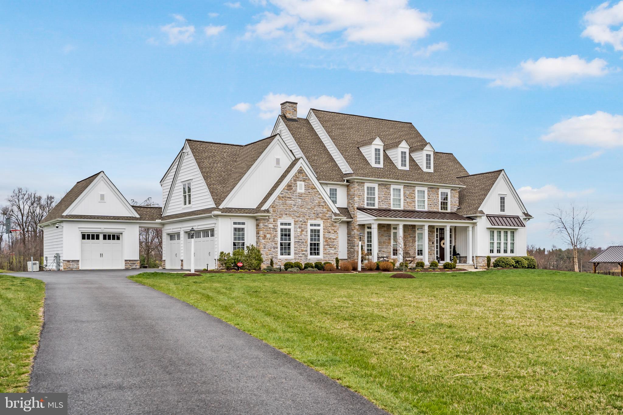 Nestled amidst the tranquil countryside of Carroll County, this Modern Farmhouse, meticulously crafted in 2018, perfectly plotted on 23 acres of picturesque landscape, offers an unparalleled retreat. Boasting nearly 7,000 square feet of finished space, 5 bedrooms and 4.5 bathrooms, this estate epitomizes luxury, privacy, cutting-edge technology and timeless style.

In-ground pool, constructed in 2020 by Anthony Sylvan, features pebble tech/gunite plaster coating, a motorized auto cover, and a salt system, all managed by an iAqua link automated system. The outdoor pavilion, crafted from reclaimed 100+ year-old barnwood, offers a cozy haven with a custom propane fireplace, automated lighting, pavilion heaters, outdoor weatherproof TV, and an 8-speaker sound system. Additional highlights include a spacious outdoor patio with a firepit.  Indoors, enjoy the convenience of a Lutron Automated Lighting Control System. The chef's-grade kitchen features JennAir appliances, quartz counters, and custom LED lighting, while the master bathroom boasts a lavish multi-shower system with Seura Hydra TV. The lower level presents the ultimate retreat, boasting a second kitchen with a dishwasher and built-in microwave, a custom Pinterest worthy bunk room accompanied by a full bathroom and oversized crossfit style home gym. A spacious living room boasting an electric fireplace and room for a billiard table—creating the perfect hangout space. The heated 3 car garage with a dog washing station adds extra convenience and luxury.  Experience the pinnacle of refined living with this exceptional estate home, where every amenity and detail has been thoughtfully designed to elevate your lifestyle to new heights of comfort and sophistication.. Located at the top of Falls Road, 35 min drive to Hunt Valley, Cockeysville and Timonium. Lower taxes compared to PA or Baltimore County taxes.  Get more bang for your buck here!!