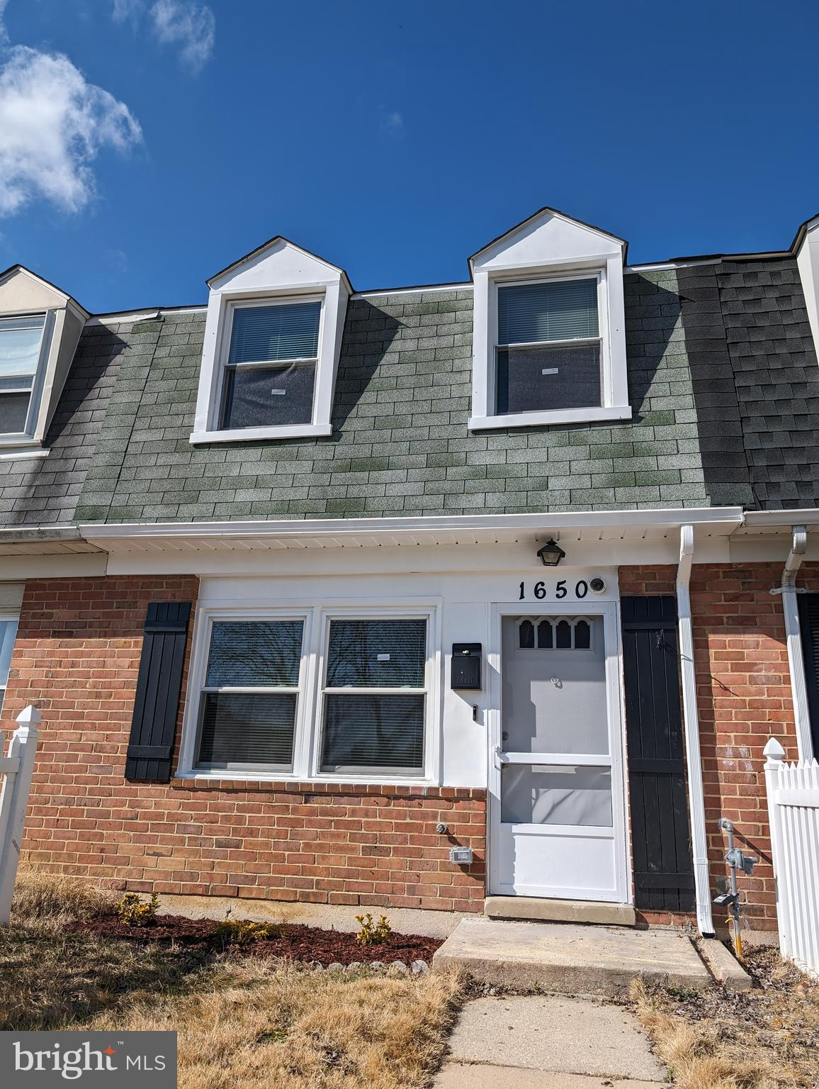 Wow! Renovated interior 2bed, 1 bath  townhome surrounded by a white picket fence.  Affordable as primary residence or investment property.  Access to covered back yard through an alley way.