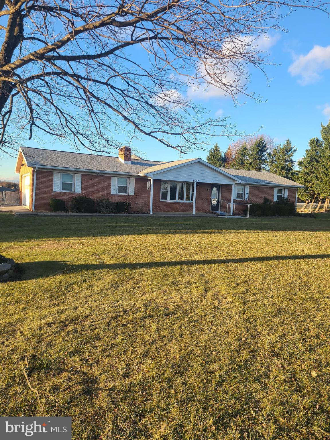 Move-in-ready brick rancher on almost an acre with no HOA! Located in the Spring Mills school district, the home provides easy access to nearby amenities and commuter routes.  Four large bedrooms and three full baths.  Detached three car garage with electric in addition to an attached two car garage allows for plenty of parking and storage.  The living room has a large bay window and fireplace.  The owners bedroom has its own private bath with walk in shower.  The fourth bedroom and family room has its own mini split AC/Heater.  Spacious laundry room.  Newly remolded kitchen with stainless steel appliances, soft close cabinets and unique back splash.  Large, level yard with two sheds and chain link fence.  This home is handicap accessible and offers widened doors.  There is also a sprinkler system in the home.  The basement has a sump pump and fireplace, however it is not finished.  It would make a great addition if finished or provide additional storage if left as is.  The home is conveniently priced and ready for its new owner.  Schedule your showing today and start the New Year off right!