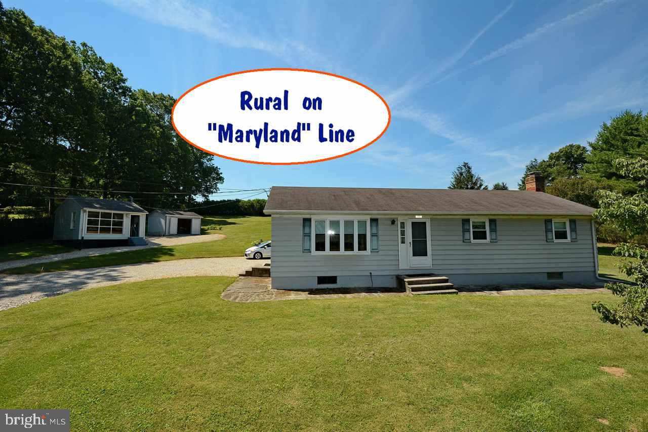USDA Financing Area - 1.4 Acres - Heated work Shop with Bay Window - Rec room with Brick Wood Burning FirePlace  and Large Bar - Country Kitchen with Dining Area - 3 Bedroom - Property Borders Maryland State Line - Easy Access to Maryland, Privacy abounds & watch the wildlife.