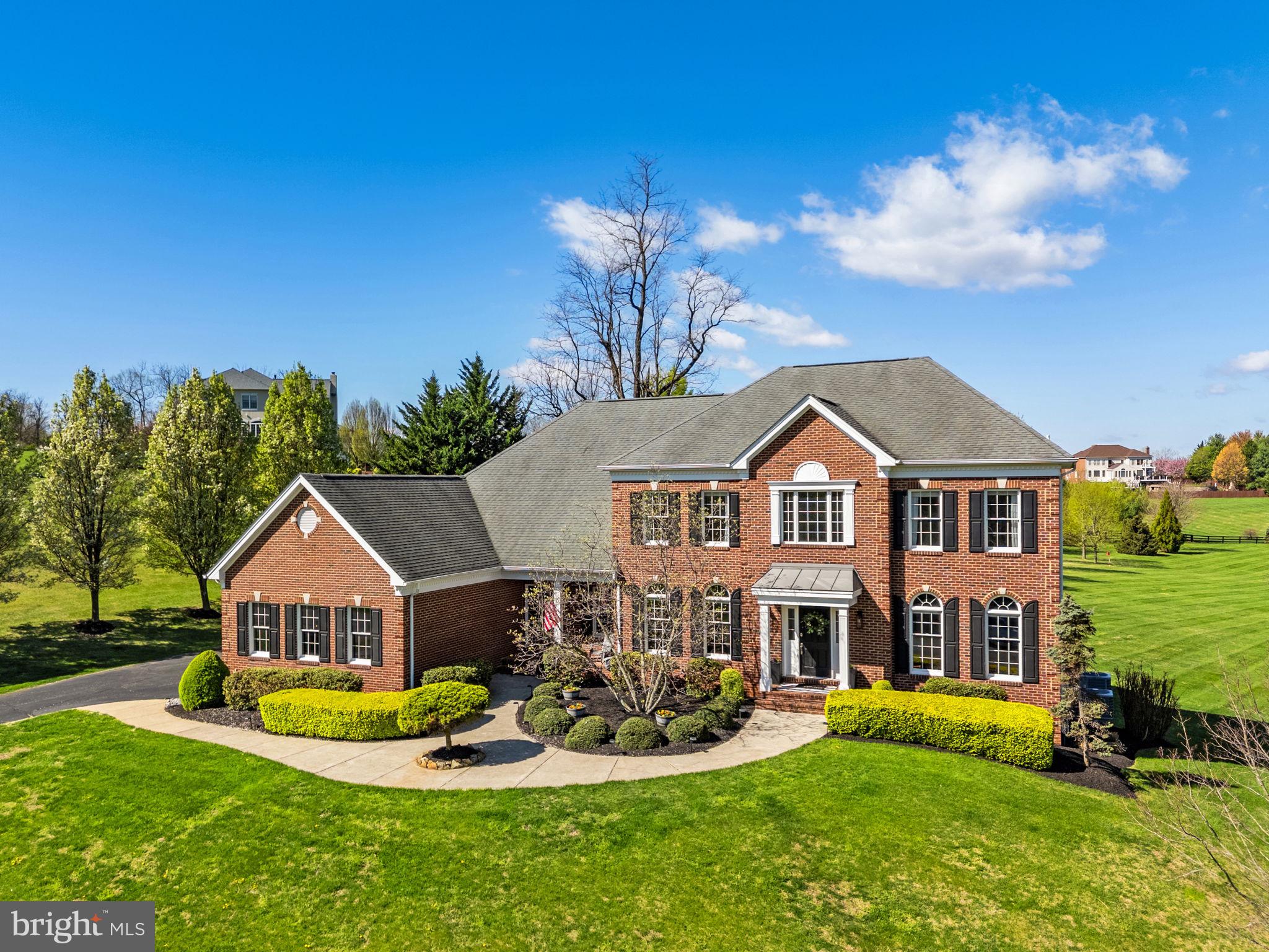 Now offered at 1,350,000, 15242 Bankfield Drive — a refined countryside retreat tucked within the prestigious Waterford Ridge community in historic Waterford.

Set on over 3 private acres with sweeping pastoral and mountain views, this exceptional brick colonial offers the rare combination of timeless elegance, modern comfort, and peaceful Virginia wine-country living — all within easy reach of Northern Virginia and Washington, DC.

Featuring 4 spacious bedrooms, 4.5 baths, and over 4,600 square feet of beautifully designed living space, the home was thoughtfully crafted for both elevated entertaining and everyday luxury. A grand two-story foyer welcomes you into light-filled interiors with soaring ceilings, rich hardwood floors, extensive millwork, oversized windows, and refined architectural details throughout.

The heart of the home is a beautifully appointed gourmet kitchen with granite countertops, stainless steel appliances, center island, butler’s pantry, and seamless flow into the expansive family room with gas fireplace. Enjoy quiet mornings in the screened porch overlooking scenic countryside vistas, or host unforgettable evenings beneath breathtaking Loudoun County sunsets.

Upstairs, each bedroom offers its own private bath, including a luxurious primary suite complete with vaulted ceilings, sitting area, spa-inspired bath, soaking tub, and dual walk-in closets.

Additional highlights include:

3-car side-load garage
Dual staircases
Dedicated home office
Extensive hardscaping and landscape lighting
Updated HVAC and well systems
Open walkout lower level ready for customization
Board fencing and expansive usable acreage

Perfectly positioned near Waterford’s historic village, destination wineries, breweries, equestrian amenities, farm markets, and the charm of western Loudoun County, this property delivers the lifestyle today’s luxury buyer is seeking: privacy, beauty, authenticity, and space to breathe.

15242 Bankfield Drive is more than a home — it’s an invitation to experience Virginia countryside living at its finest.