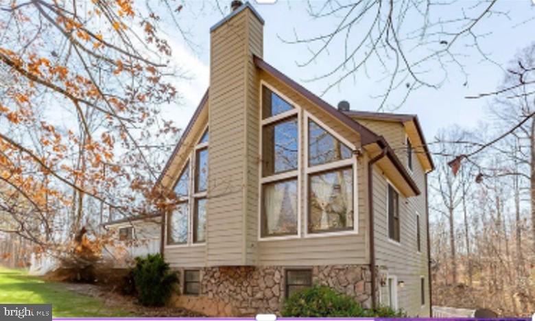 Priced below the most recent appraisal, offering buyers a rare opportunity for immediate equity!!!

Lake life is calling—now is your opportunity to answer at an exceptional new price point. Welcome to 7312 Sugar Hollow Road, a beautifully positioned retreat offering privacy, amenities, and effortless access to everything Lake Anna has to offer.

Set on a private 1-acre lot, this home delivers peaceful surroundings just minutes from local dining, local breweries, and Lake Anna State Park. An assigned boat slip (#43) just down the street makes spontaneous lake days and sunset cruises a breeze.

The backyard is built for relaxing and entertaining with a resurfaced in-ground pool, fresh decking, and multiple outdoor living spaces. Inside, you’ll find light-filled living areas, a cozy fireplace, rich finishes, and a well-appointed kitchen with stainless appliances and generous counter space—ideal for gathering.

With four bedrooms and three full baths, there’s plenty of space for guests or extended stays. The primary suite offers a spa-like retreat with soaking tub, while the finished walk-out basement provides flexible space for guests, recreation, or a home office. Two balconies and a large rear deck extend the living space outdoors.

Recent updates include newer HVAC, resurfaced pool, and fresh decking, allowing you to focus on enjoyment rather than projects.

Whether you’re seeking a full-time residence, weekend escape, second home, or short-term rental opportunity, this property offers the location, flexibility, and lifestyle that make Lake Anna so desirable.

Offered at $525,000—ready for immediate enjoyment and your next chapter at the lake.