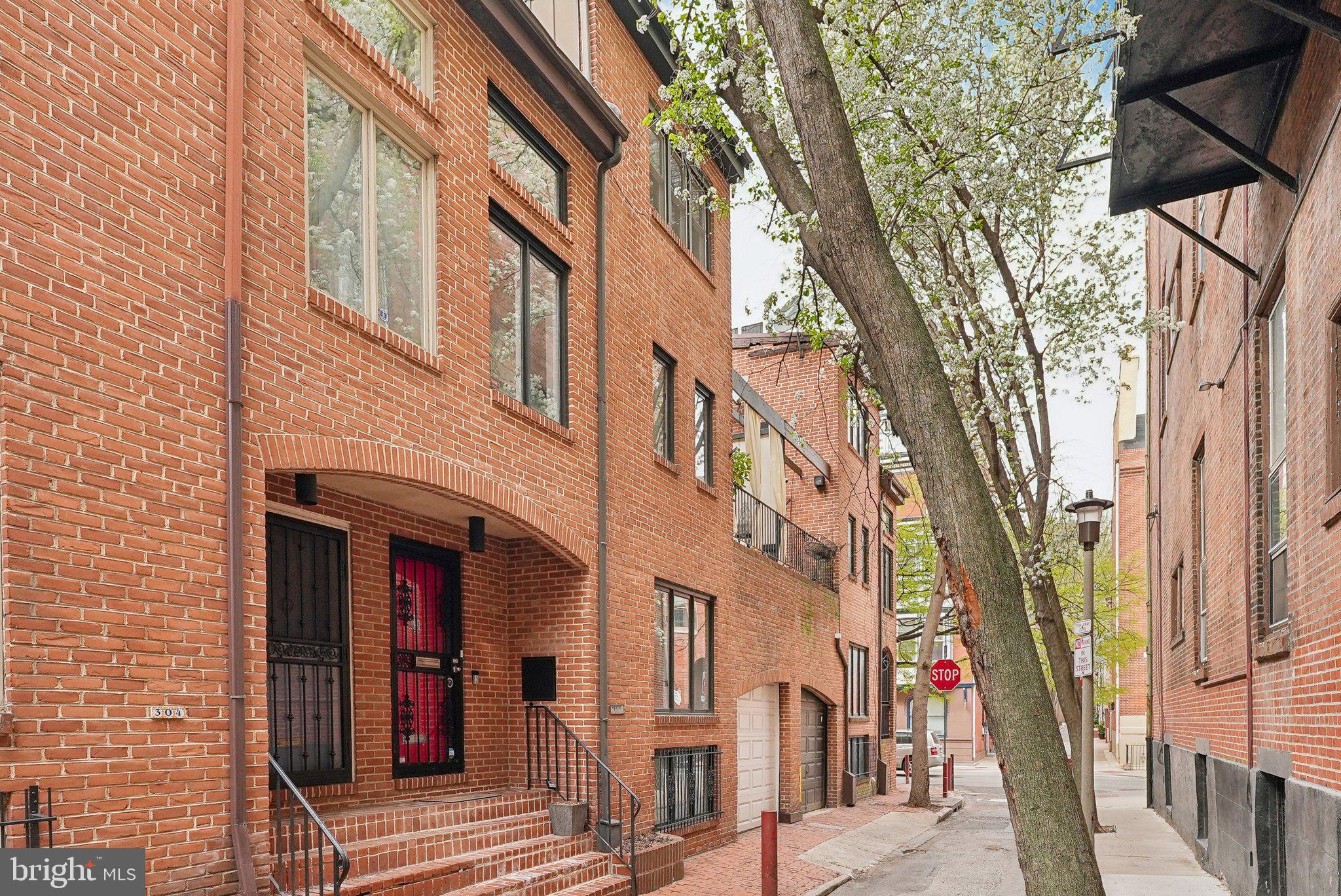Nestled on a tranquil, tree-lined street in the heart of Washington Square West, this exquisite townhouse at 302 S Quince St promises a blend of sophistication and convenience. Located just a stones throw from Spruce st, this property is a flawless fusion of modern amenities and enchanting neighborhood charm with PARKING.
 
Enter into a spacious, light-filled living room with a wood-burning fireplace and plenty of room for seating and entertaining. Downstairs you will find a bright and completely updated kitchen with stainless steel appliances, coffee bar and a large dining area. A separate laundry room and half bath are also on this level for added convenience. On second floor you have your first generously sized bedroom with a custom walk-in closet.  Through this room also provides access to your large private deck overlooking Quince St. You also have a full hall bathroom, and an additional sun-drenched flex space with plenty of opportunity. The third floor houses the primary suite, walk-in closet and updated en-suite bathroom. 
 
Adding to the appeal is the rarity of garage parking in such a coveted location. Less than three blocks from the Avenue of the Arts, and a leisurely stroll to Washington Square Park, this location is enviable. The neighborhood is alive with an array of coffee shops, restaurants, and cultural venues, providing an unparalleled urban living experience.
 
For those seeking a blend of modern convenience and timeless charm in Philadelphia, your search ends at 302 S Quince St.