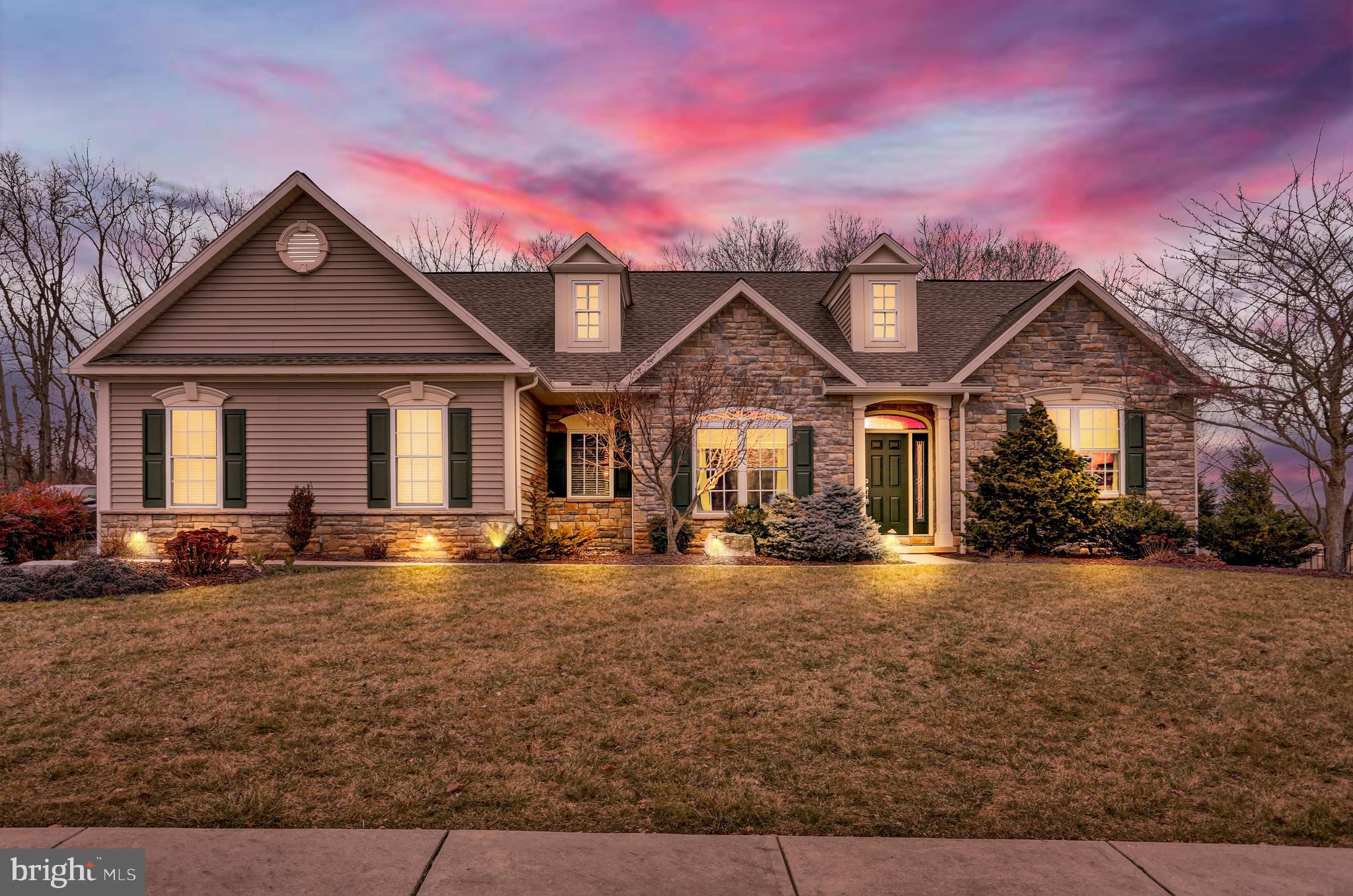 This is a stunning, ranch home with a side entry 2 car garage located on a premier lot within the Green Valley Estates community and Wilson School District. Upon entering the home, you will immediately be wowed by the open floor plan including the expansive tiled foyer, arched doorways, and vaulted and tray ceilings. The great room features rich hardwood flooring, a gas fireplace with built in entertainment storage, and a vaulted ceiling with skylights. Next to and open to the great room is the well appointed kitchen. The kitchen boasts tile flooring, solid wood cabinetry with tile backsplash, granite countertops, stainless steel appliances, pantry, eating bar, and a dining area that leads to the covered deck with ceiling fan. The formal dining room with tray ceiling has been converted to a home office with hardwood flooring, built in cabinetry, and french pocket doors. To the left of the foyer is a hallway leading to the main floor laundry and secluded master suite, complete with vaulted ceiling, walk in closet, and a luxurious en suite bathroom complemented by a custom tiled, walk in shower and a double bowl vanity featuring recessed mirrors set in a tile backsplash. On the opposite end of the home, there are 2 additional bedrooms with large closets and a 2nd full bathroom. From the foyer, you can also access the partially finished, walkout lower level complete with 2 very spacious recreational rooms, 4th bedroom, 3rd full bathroom, and 2 large storage rooms. The rec room has double doors that lead to the stamped concrete patio that extends the width of the home and your own beautiful inground salt water pool. While enjoying the outdoor features, you will also have the pleasure of looking at nothing beyond your home other than greenery and open fields behind your fenced rear yard. Come take a look, fall in love, and make this spectacular home your home.