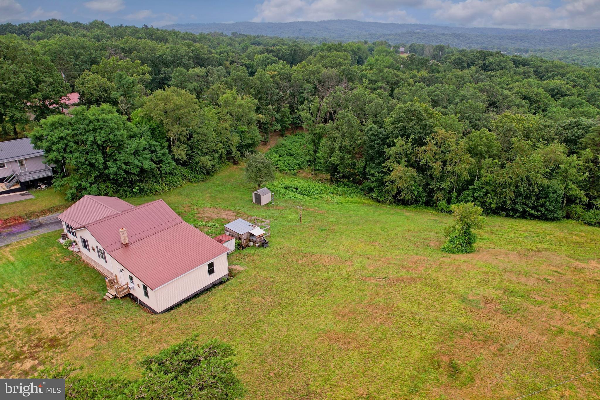 Escape to the peace and beauty of country living with this spacious 5+ bedroom, 2.5-bath home situated on just over 3 acres of partially wooded land. Enjoy breathtaking mountain views, a large yard perfect for outdoor activities, gardening, or entertaining, and plenty of room to roam.

Inside, you'll find generous living space with all kitchen appliances conveying, making your move even easier. The full basement offers additional space that can be finished to create a recreation room, home office, guest suite, or whatever best fits your lifestyle.

Conveniently located just minutes from shopping, dining, and everyday amenities, this property offers the perfect blend of privacy, scenic surroundings, and accessibility. If you've been looking for a home with room to grow, both inside and out, this country retreat is one you won't want to miss!