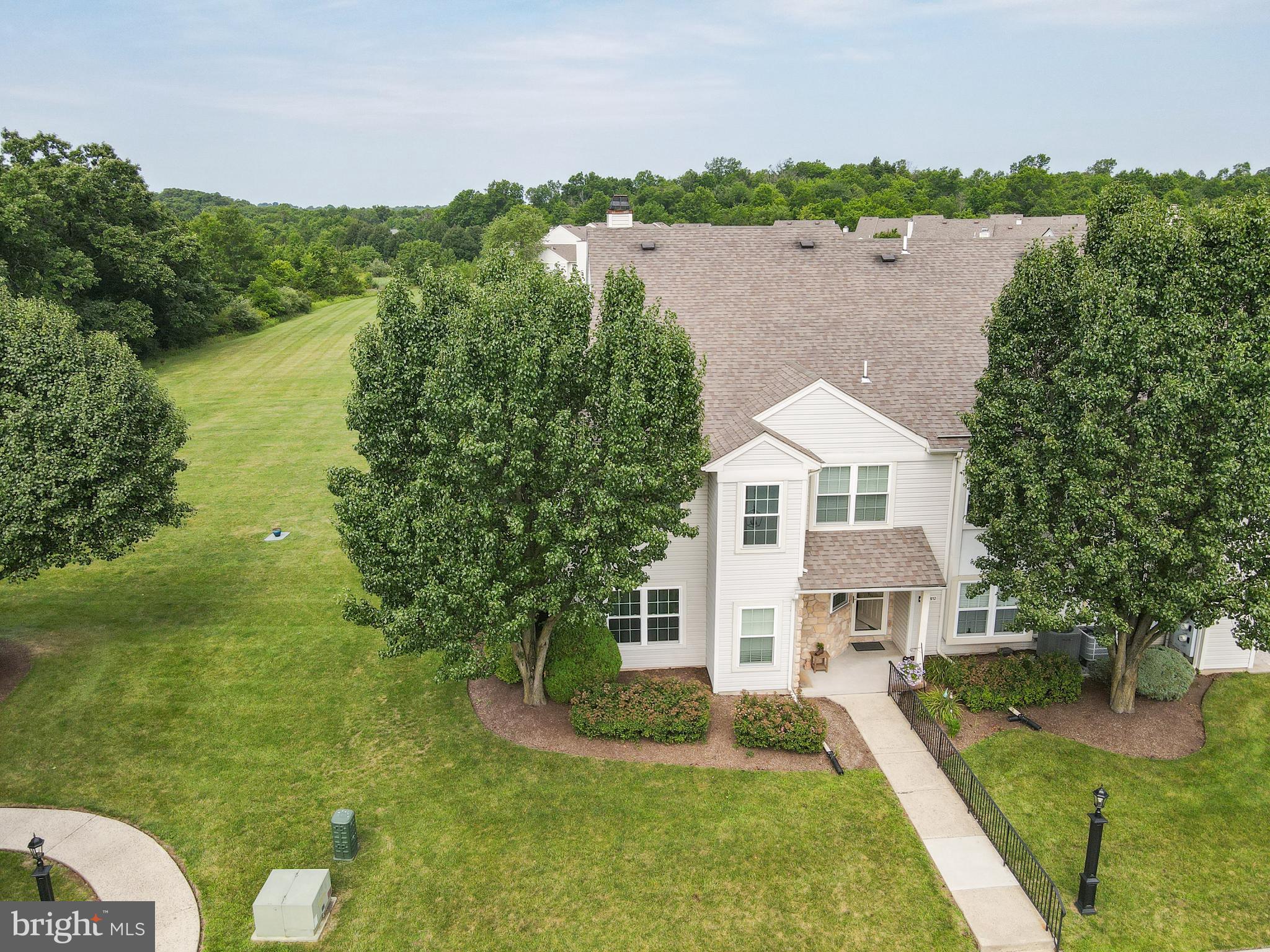 Open House Saturday, July 18th 12:00-2:00
Welcome to 911 Eaton Court, a beautifully updated three-bedroom, two-full-bath end-unit home in Quakertown Bucks County.  This home will end your search today! All the work and upgrades have been done! Starting with the fact that this home is ideally positioned beside expansive common grounds and mature trees, this inviting property offers peaceful views, added privacy, and a wonderful connection to nature.  Notice the deer in the picture, not staged! Inside, you'll find an open living and dining area that features rich hickory hardwood flooring and a striking corner wood-burning fireplace enhanced with stone veneer and an oak mantel.  Also, a sliding glass door opening to the beautiful grounds, patio and storage room. A coordinating stone accent wall adds warmth and character to the kitchen area. The kitchen is equipped with a new glass-top electric range, microwave, and quiet KitchenAid dishwasher. Cabinets equiped with sliding shelves. One bedroom is conveniently located just off the living room and kitchen and includes a walk-in closet, offering flexibility for guests or a home office.
The spacious primary bedroom features acacia hardwood flooring, a ceiling fan with wireless remote, and attractive wood-plank with added insulation and trim details.  The completely remodeled private bath includes tile flooring and a tiled walk-in shower with a slow-close Kohler glass door. The remodeled hall bath offers tile flooring, partial wall tile, and a deluxe jetted walk-in tub with mood lighting and music.
Additional improvements include nine Pella windows with screens, a newer HVAC system, 50-gallon water heater, 40-gallon water softener, replacement interior doors, a Therma-Tru front door, Larson storm door, dining-area chandelier, and LG stacked washer and dryer. Most major improvements were completed in 2024 and 2025. Two wall-mounted televisions will remain, including the 65-inch LG Smart TV in the living room!  All the high-end upgrades along with the amazing end-unit location will make this beauty your next home. Thoughtfully renovated end unit combines comfort, accessibility, stylish finishes, and tranquil surroundings—all in a convenient Quakertown location.