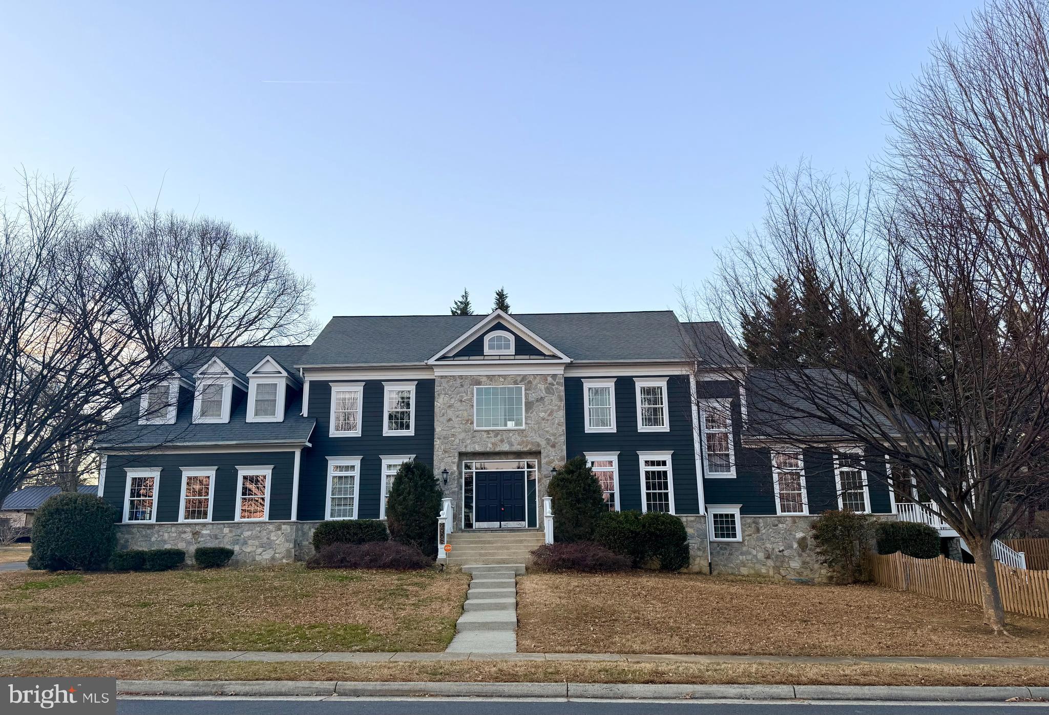 LOCATION AND ELEGANCE.  Perfectly located just minutes from the Vienna Metro, Oakton High School and Shopping Center, this stunning Dean Design custom home offers the best of Oakton living with space, style, and convenience all in one. Built with HardiePlank and stone, the home sits on a corner lot facing a quiet cul-de-sac of fine homes and features a side-load three-car garage plus a large covered veranda with steps to a fenced-in yard.  Inside, hardwood floors run throughout the main level setting the tone for the home’s open and thoughtfully designed layout. A private office sits to one side of the foyer, with a dining/living room on the other. Toward the back of the home, the living and entertaining spaces truly shine. The custom kitchen is a standout, featuring Wolf and Sub-Zero stainless steel appliances, generous workspace, and a bright breakfast room with built-in bench seating (and storage). The kitchen flows to the two-story family room, anchored by a stone gas fireplace that rises to the ceiling, and opens to a covered deck with IPE Brazilian mahogany decking—perfect for indoor-outdoor living.  Upstairs, you’ll find a well-designed bedroom level with a guest suite and private bath, two additional spacious bedrooms connected by a buddy bath and hallway, and a luxurious primary suite. The primary bedroom and sitting area feature tray ceilings with rope lighting in the cove molding, while the spa-like primary bath includes a rain shower with body sprayers, dual vanities, a jetted soaking tub, and a private water closet.  The lower level, with NEW carpeting throughout, offers flexibility with a media area, recreation and game spaces, plus a legal fifth bedroom and full bath - great for guests or extended stays. The home is also wired for surround sound, central vacuum, and an alarm system.  A rare combination of custom craftsmanship, smart design, and unbeatable location—this home puts you close to everything Oakton has to offer while still providing a peaceful, neighborhood setting.