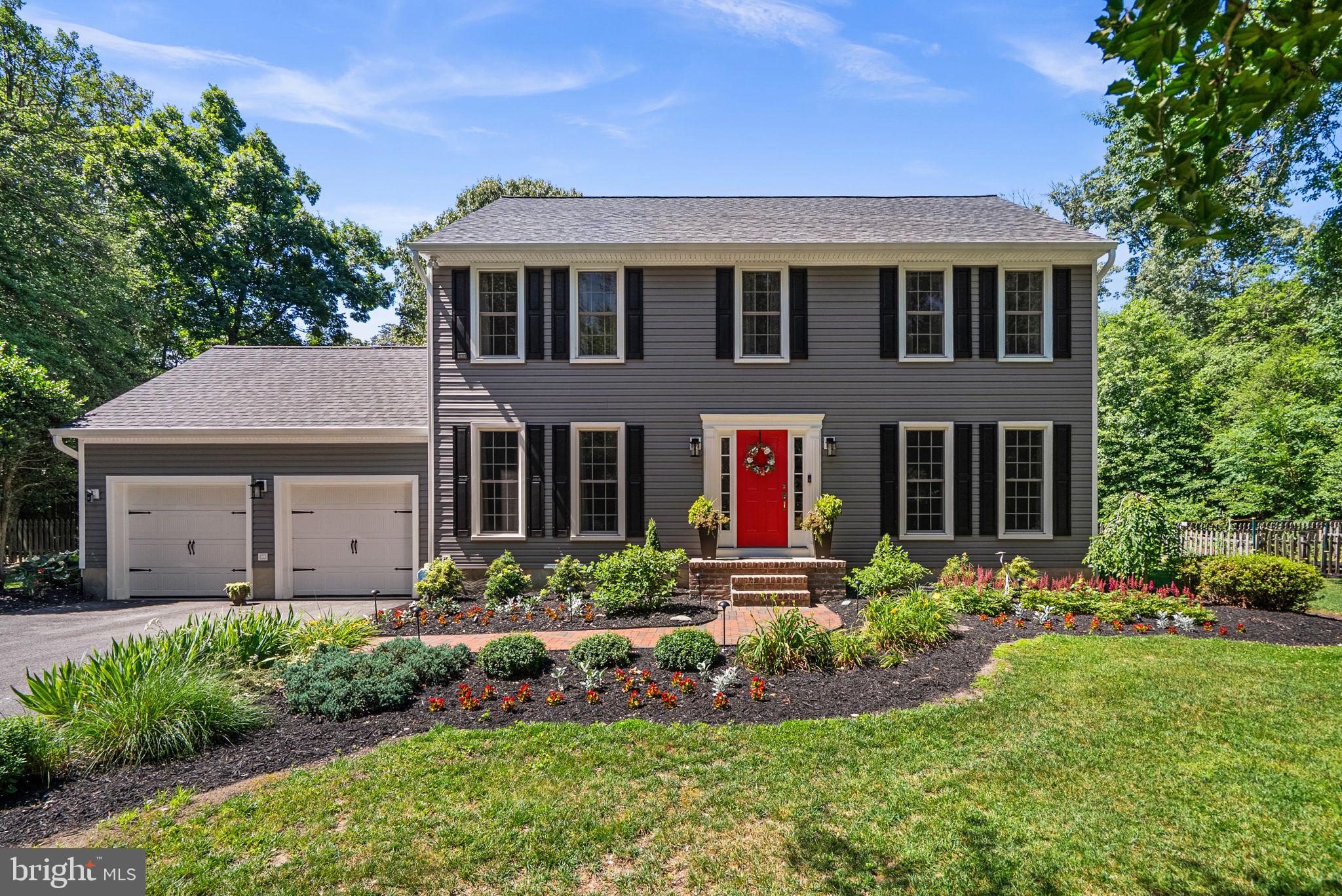 Stunning Severna Park home built by award-winning Koch Homes, situated on a 1.26 acre wooded lot at the end of a cul de sac.  Beautifully landscaped, the fully fenced yard is enhanced by mature trees, established gardens, and winding nature trails, offering a peaceful park-like setting with exceptional
privacy.  Hardwood flooring extends throughout the home.  Designed for everyday living and entertaining, the kitchen was remodeled in 2023 with quartz countertops, a center island with seating, tile back splash with stainless steel appliances.  The kitchen features a charming breakfast nook and bay window with views to the large backyard and  flows into the inviting family room with natural gas fireplace, built-in shelving, and sound system throughout the first floor.  Sliding glass doors lead to a screened porch with remote controlled skylights providing an ideal setting for dining, entertaining, or simply enjoying the beautiful landscape.  Beyond is the brick paver patio with a dedicated natural gas line for grilling equipment.  Elegant entertaining spaces include a formal dining room framed by floor-to-ceiling windows, while a separate living room offers flexibility for a study, den, or home office.  The spacious owner’s retreat on the upper level features a large bedroom with a walk in closet, and adjoining study (easily convertible to a fourth bedroom per the original builder floor plan).  The en suite bath is spa inspired with heated
floors, a remote controlled skylight, dual-sink granite vanity, air-jetted soaking tub, and custom-tiled shower with a frameless glass enclosure.  Two secondary bedrooms and an updated hall bath complete the upper level. One of the bedrooms includes a built-in queen size Murphy bed, creating a versatile space well suited for overnight guests, crafts, or remote work. The partially finished lower level, featuring a temperature controlled walk in wine cellar and a full bath rough-in, provides excellent potential for future living space.  A dedicated circuit and outlet is installed in the garage to support (EV) charging. Year-round enjoyment awaits outdoors where mature trees an lush landscaping create a private natural sanctuary. An established kitchen garden, winding nature trails, and inviting outdoor gathering areas combine to create an exceptional setting for entertaining, and connecting with nature.  Recent improvements include new roof, siding, gutters/downspouts, shutters, five remote controlled skylights, and repaved driveway (2025). Remodeled kitchen, new Decora switches/outlets throughout, and new garage door openers and springs (2023). Replacement Pella windows throughout.
