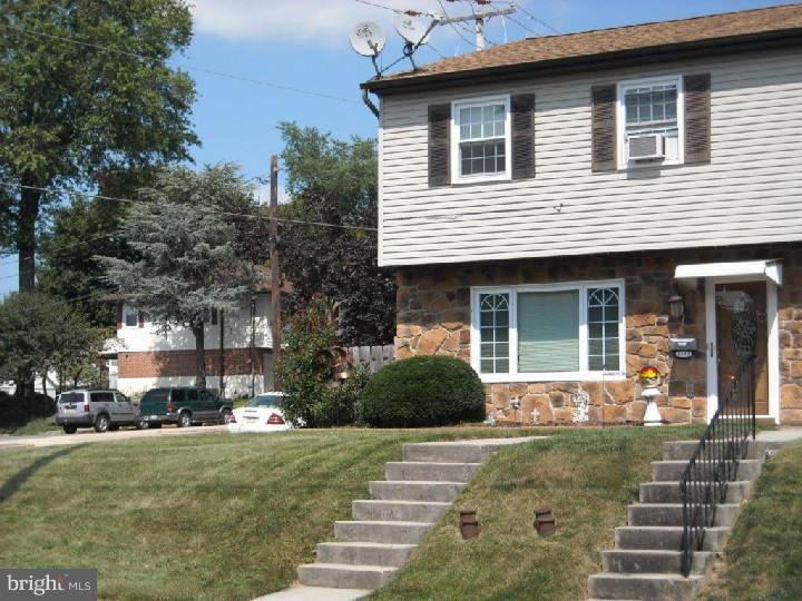 Super clean corner lot stone front semi in convenient borough of Laureldale.  New custom tile and hardwood floors.  Designer galley kitchen with new granite counter tops, built in microwave, dishwasher, plus first floor laundry and powder room.  Private covered patio, fenced in back yard with oversized shed.  Off street parking.  Freshly painted interior.  New roof and replacement windows in 2006.  Nothing to do, but move in!!!!