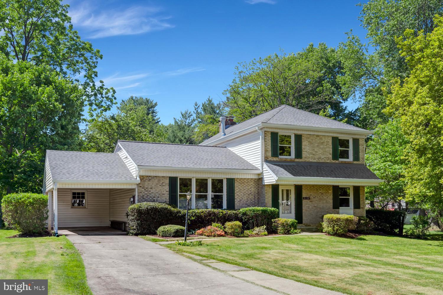 Welcome home to this charming split-level Colonial tucked away on a peaceful cul-de-sac in the desirable Manor Lake community. Offering over 2,100 square feet of comfortable living space, this inviting home features 5 bedrooms and 3 full baths, providing plenty of room for family, guests, or flexible living arrangements. The main level offers the convenience of a first-floor bedroom and an additional room that can serve as a home office, guest room, or bedroom. The bright and functional layout includes a welcoming family room with a cozy fireplace that flows into the updated kitchen, featuring a cooktop, double oven, and ample space for preparing meals and entertaining. Hardwood, ceramic tile, and carpet flooring add warmth and character throughout. Upstairs, the spacious primary suite offers a private ensuite bath and its own fireplace, creating a relaxing retreat at the end of the day. An unfinished basement provides endless potential for additional living space, recreation, or storage. Surrounded by beautiful mature trees and peaceful views, the property offers a serene outdoor setting. Enjoy the fenced backyard, perfect for pets, play, gardening, or outdoor gatherings. Additional features include an attached carport and concrete driveway. Step outside your front door and discover a vibrant neighborhood that has community spirit. Manor Lake offers a wide array of amenities, including the Flower Valley Bath and Racquet Club (memberships available), where you can enjoy tennis, pickleball, swimming, and social events. Enjoy hiking around Lake Frank with  scenic walking trails through Rock Creek Park. Residents stay connected through an active listserv and a lively calendar of events. With convenient access to the ICC and Metro’s Red Line, commuting to Baltimore or DC is quick and stress-free. Combining comfort, convenience, and a wonderful neighborhood setting, this home is ready for its next chapter.