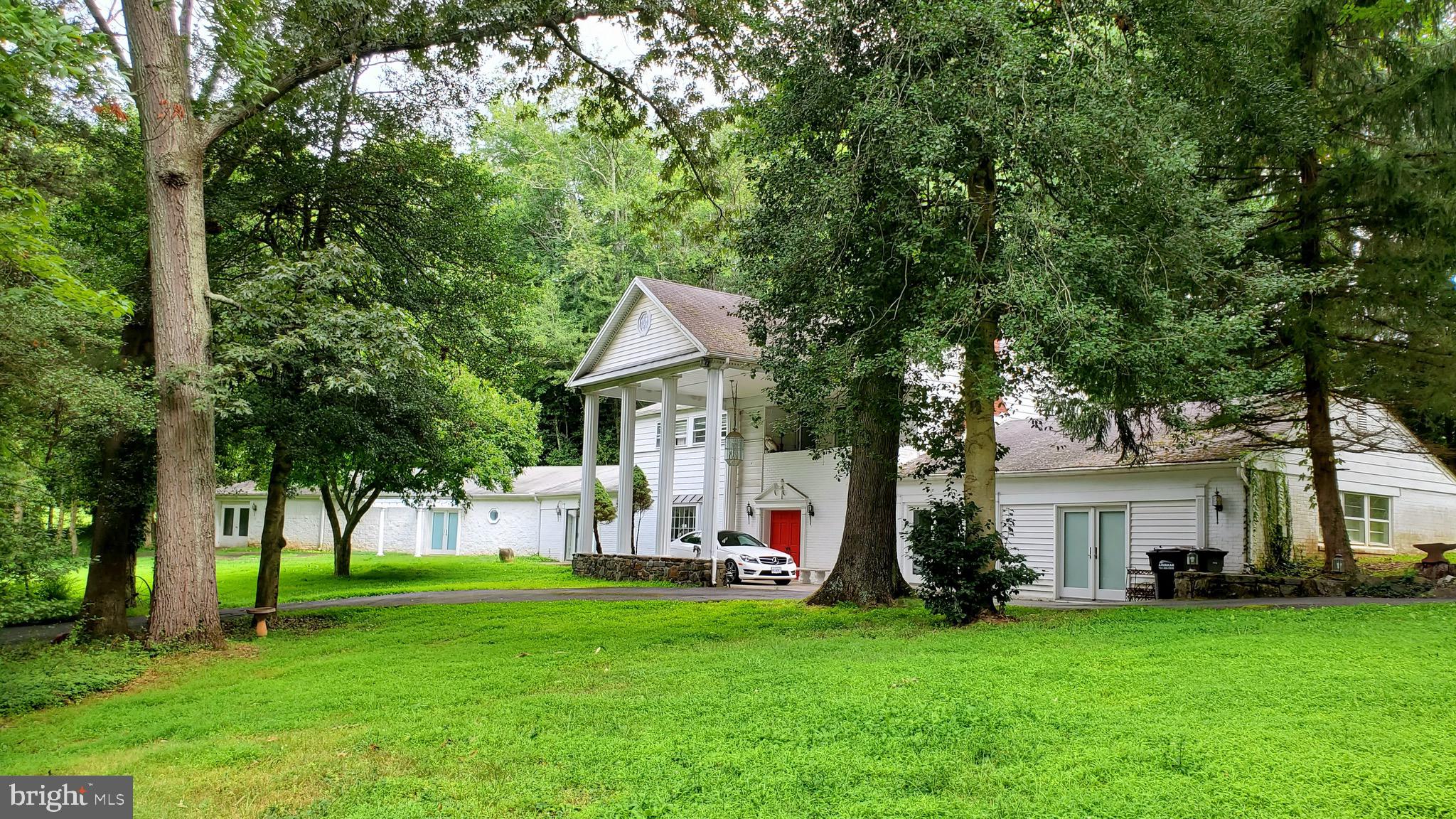 Spacious Great Falls home  with 4424 sq ft above ground on a 2acre lot in a coveted school pyramid.  Expect commuting convenience with only a few minutes drive to  major commuting routes providing quick access to shopping, restaurants, offices, major employers and business sites, and health care facilities. 

This 2 level home, built in 1956 (top level), 1968 (lower level right side) with a large addition in 2001 (left side), offers 4+ bedrooms, 4 full baths, 3 heat pumps, 3 fireplaces (2 propane & 1 wood-burning), 2 kitchens, 2 electric services (the addition gets its own bill).  Large rooms and open floor plan with majority of space on main level (think of as an incredibly spacious rambler +  additional private space for independent living on upper level)  Home  includes a bonus main level  living space that was previously a  garage (easily converted back at modest cost).

Stunning 2 acre lot with a circular driveway includes 2 accesses off Springvale Rd with at least 15+sparking spaces and ample room for adding a pool and/or possible tennis court.  Most of the adjacent homes beyond this corner lot have  already connected to public water. Fairfax Water has confirmed that  public water hookup would be available if desired.

This well-loved home provides enticing opportunities for you to update into your own showplace.  The rare expanse of almost step-free space on the main level could have special appeal for a wide array of occupants, including those seeking suitable accessible space for in-law suite/s.  You might also want to check out the strong potential for satisfying Fairfax County requirements for allowing a rentable accessory dwelling unit (ADL) which could provide reliable extra  income for the owner.  For further information regarding requirements please check the Fairfax County website which includes a description of ADL requirements,  FAQ pages, and ADL application information.
 
INVESTOR ALERT!  Visualize the array of additional rental and potential residential-based business opportunities  this unique, centrally located property presents.