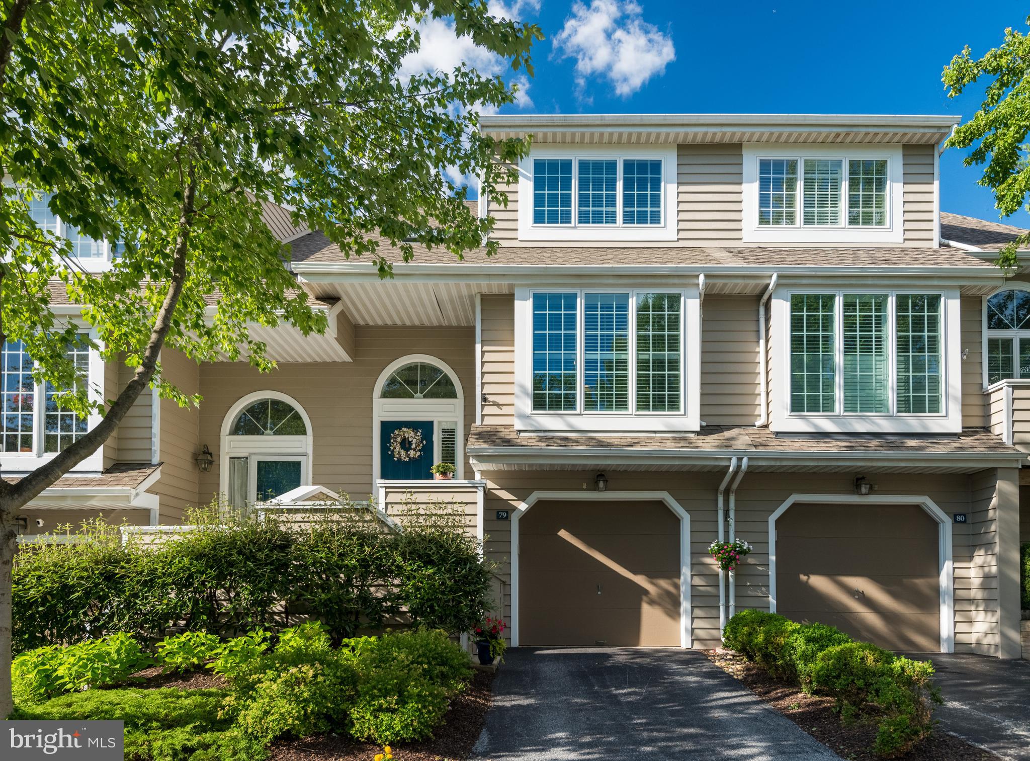 Welcome to 79 Andover Court, a beautifully updated and meticulously maintained home in the highly sought-after Newport Village community of Chesterbrook, just steps from Wilson Farm Park. This pristine home offers three wonderfully finished levels of flexible living space, peaceful views overlooking a serene community open space and an ideal location within the top-ranked Tredyffrin-Easttown School District. The two-story entrance hall with a skylight features offers beautiful tile flooring and leads up to the open concept first floor featuring hardwood flooring and recessed lighting. The spacious living and dining areas offer a comfortable, spacious feel, with a distinctive light fixture adding a special touch to the dining area. Two sets of sliding glass doors flank a gas fireplace and open to a fabulous low-maintenance Trex deck, perfect for enjoying the private views, grilling and outdoor dining. The gourmet kitchen is beautifully designed with tile flooring, quartz countertops, a quartz center island with pendant lighting and a separate quartz coffee bar. Additional highlights include a subway tile backsplash, plantation shutters, pantry storage, a Bosch dishwasher and stainless steel appliances. Upstairs, both bedrooms and the hallway feature hardwood flooring. The spacious owner’s suite offers a large walk-in closet and a gorgeous, fully renovated bathroom featuring tiled flooring, a double marble vanity, a stand alone Kohler soaking tub, and a tiled shower with a frameless surround.  The second bedroom features a ceiling fan and is serviced by a fully renovated hall bathroom complete with a nicely sized tiled shower, frameless glass surround, and marble vanity. The finished lower level provides incredible flexibility and can easily adapt to a variety of needs. The family room includes two built-in Murphy beds, allowing this space to effortlessly function as a comfortable family room, bedroom, home office or ideal multi-generational living space. Two sliding glass doors open to the rear patio area, extending the living space outdoors. The lower level also features a full, renovated bathroom with a tiled shower and a frameless shower door. Additional highlights include a double closet in the lower-level family room/bedroom area, tile flooring in the lower-level hallway, and convenient storage located underneath the staircase with access from both the hall closet and directly from the garage. Major updates include 10 replacement windows, 4 sliding glass doors, and the skylight completed in 2019, a new roof installed in 2021, and a newer low-maintenance Trex deck added in 2024. Ideally situated near fabulous Wilson Farm Park, the Chesterbrook trails, the Chesterbrook Shopping Center, Valley Forge National Park, the King of Prussia Town Center and the trains, shops, and restaurants of The Main Line. This exceptional home is in perfect move-in condition, located in a prime location within one of Chesterbrook’s top communities. A rare opportunity to simply move in, relax, and enjoy! This is the one you’ve been hoping would come on the market. Welcome home!