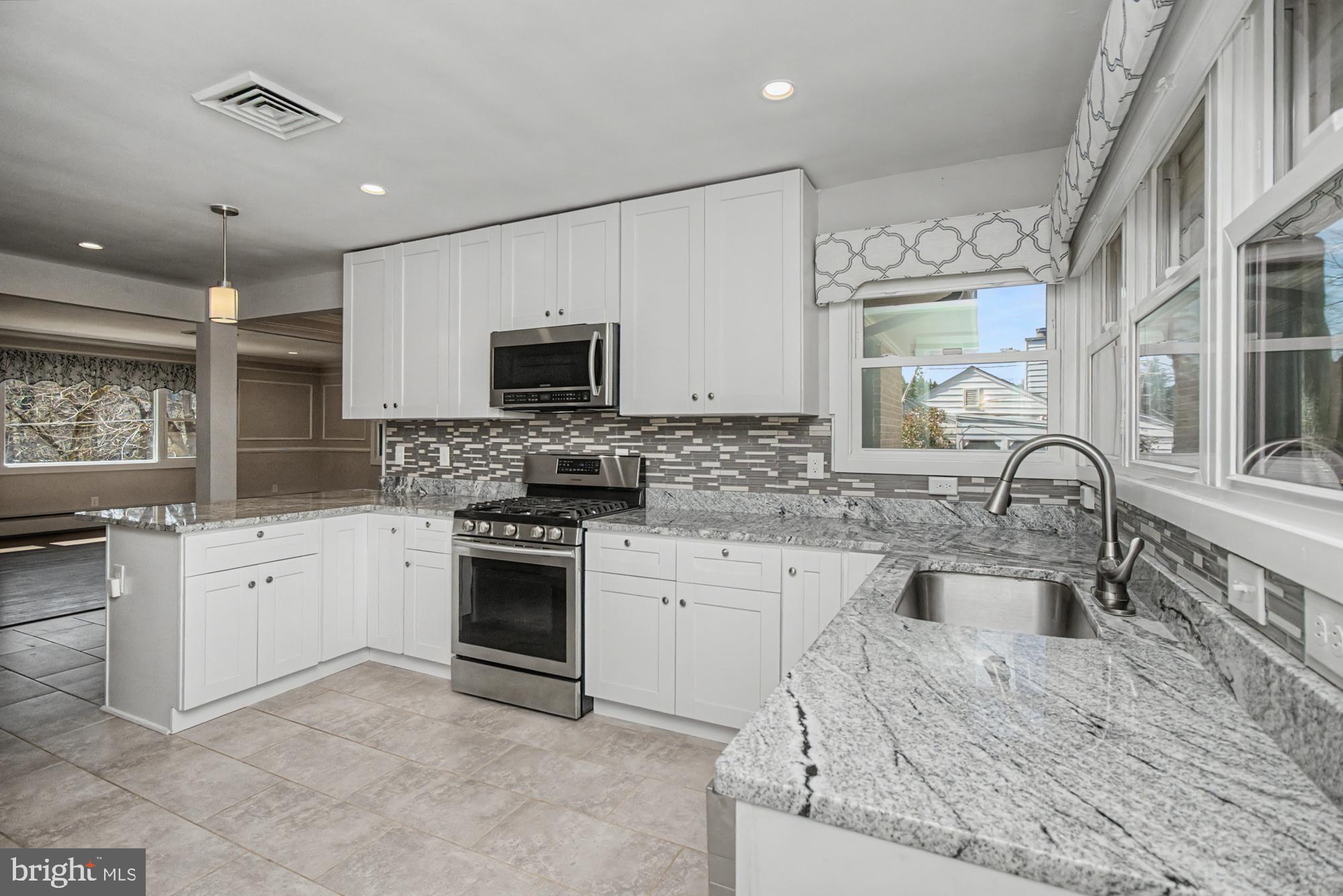 Rare opportunity to own in highly sought-after West Towson—one of Baltimore County’s most desirable neighborhoods! This beautifully renovated 4-bedroom, 3-bath rancher offers nearly 3,200 square feet of finished living space, including a fully finished basement and a 2-car garage.

The heart of the home is the stunning open-concept layout, seamlessly connecting the gourmet kitchen, living room, and spacious dining area—perfect for both everyday living and entertaining. The luxury kitchen features stainless steel appliances, granite countertops, and exceptional flow that makes gathering effortless.

The main level is highlighted by gleaming hardwood floors, a convenient first-floor laundry, and an unbelievable primary suite. Retreat to your private oasis complete with a massive walk-in closet and stylish barn doors leading to a beautifully updated en suite bath with double vanity and an impressive stand-up shower.

The fully finished basement adds even more versatile living space—ideal for a media room, home office, or guest accommodations.

Additional upgrades include new Pella windows, gas fireplace, central air, and a brand-new HVAC system. Outside, enjoy copper gutters, tiered landscaping, and a rear patio designed for relaxing or entertaining.

This property also includes an additional parcel of land and a driveway that accommodates four vehicles, in addition to the garage. Ideally located on the quieter end of Chesapeake Avenue, just minutes from the Towson YMCA, shopping, dining, and top-rated Baltimore County schools.