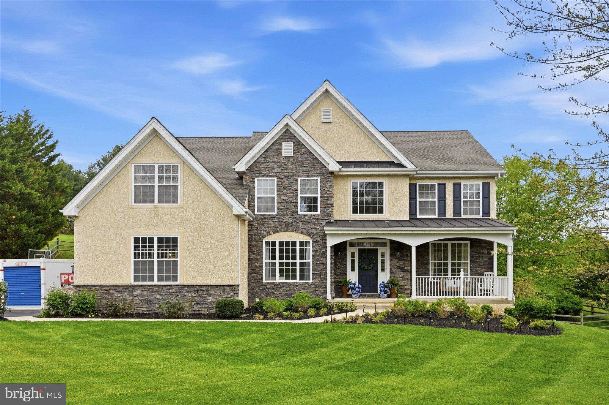 Welcome to 104 Cezanne Court, a beautifully upgraded Wilkinson-built Colonial tucked on a professionally landscaped acre-plus lot in Southern Chester County, where rolling countryside views set the scene for exceptional everyday living. Since 2020, the current owners have invested over $300,000 transforming this already impressive home into something truly special — and it shows at every turn.
At the heart of the home is a fully expanded and redesigned gourmet kitchen that will stop you in your tracks. A dramatic 12-foot center island anchors the space, dressed in quartz countertops and flanked by custom white cabinetry with brass hardware, glass-front uppers, and a bold navy island base. Z-Line Autograph Series professional appliances — including a 48" dual-fuel range with pot filler and stainless steel range hood — bring serious function to match the stunning aesthetic. The vaulted morning room flows naturally from the kitchen and opens through a new sliding glass door to the fully rebuilt deck, where the views of the surrounding hills make every meal feel like an occasion.
Hardwood floors, refinished in 2023 and extended throughout the main level and into the siting room, create a warm and seamless feel from room to room. The two-story sitting room is anchored by a gas fireplace with an updated surround and flanked by built-in cabinetry. Main level rooms offer timeless details — crown molding, chair rail, and wainscoting — while a private study with French doors rounds out a main level designed for both entertaining and everyday life.
Upstairs, the primary suite is a true retreat with a tray ceiling, walk-in closet, second closet and a spa-inspired bath featuring a soaking tub and glass shower. Three additional bedrooms, one with its own en-suit, share a hall bath with a double vanity. Brand-new carpet was installed throughout the upper level in Spring 2026. The walk-out basement with 9-foot ceilings offers a blank canvas ready for whatever you envision, and the expanded mudroom (added 90 sqft) and 2+ car garage keep daily life effortlessly organized.
Major systems have been addressed as well: new roof in 2026 with a transferable warranty, HVAC replaced in 2022, new hot water heater with mixing valve, whole-house generator, and surge protector. Just minutes to Route 1 with easy access to dining, shopping, golf, and commuter routes to both Wilmington and Philadelphia.