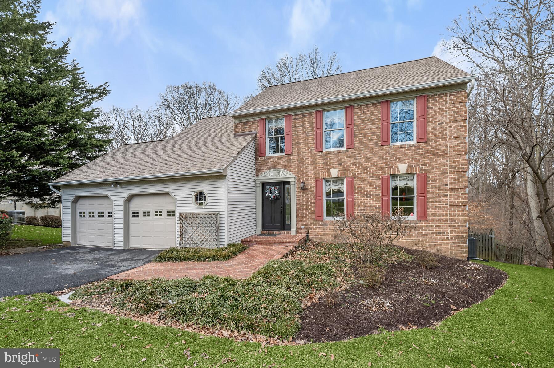 Nestled within a peaceful neighborhood, this inviting 5-bedroom, 3.5-bath home offers a blend of comfort and sophistication. The updated kitchen sparkles beside a family room that shines with vaulted ceilings, skylights, and a warm brick fireplace. Entertain in style with the separate dining room, ready to host your most memorable dinners. The primary bedroom sanctuary features an ample walk-in closet and an en-suite bathroom for a touch of luxury. For those who work from home, enjoy the versatility of an upper-level office that doubles as an extra bedroom, complete with a walk-in closet and a serene view of the vibrant family room activities below. Two more bedrooms complement the upper level's accommodations. Indulge in ultimate leisure in the fully finished basement, equipped with a full bath, additional bedroom, and a walkout that leads you into the embrace of nature. Revel in the backyard's tranquility from your deck, bordered by woods and a whispering creek. With a 2-car garage included, your new home melds serene living with modern convenience. Located in a nationally recognized school district, this home offers a solid foundation for comfortable living and learning.