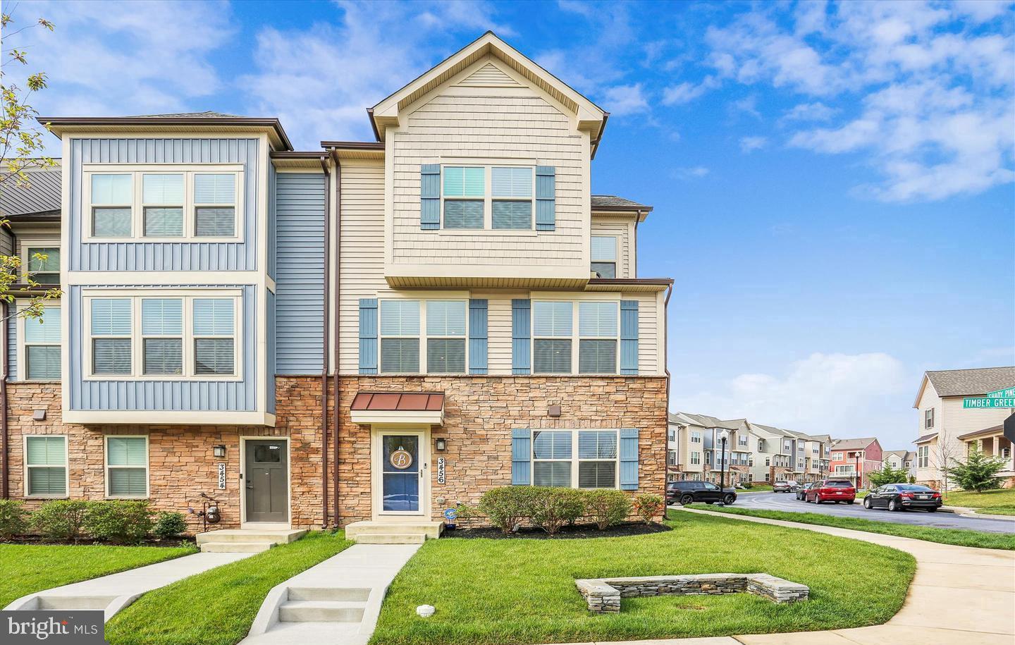 Welcome to Stone Barn Village at the Villages of Urbana, where luxury living meets everyday convenience in the highly sought-after and top-rated Urbana School District. This stunning Serenade Model end-unit townhome, just 4 years young, offers 2,200 square feet of beautifully designed living space across three levels and includes a two-car garage and a covered outdoor deck—perfect for modern living.
This light-filled home features 3 spacious bedrooms, 2 full bathrooms, 2 half bathrooms, and a versatile rec/office room. The interior is enhanced with custom blinds, extra windows, and an open-concept layout ideal for both entertaining and everyday comfort.
The main level showcases a luxury kitchen outfitted with custom cabinetry, a large center island with pendant lighting, quartz countertops, stainless steel appliances, a pantry, and a convenient half bath. Adjacent to the kitchen is a generous dining area with access to the covered deck, perfect for outdoor dining. The great room features recessed lighting and durable luxury vinyl plank flooring, creating a seamless and stylish space.
Upstairs, the primary suite impresses with tray ceilings, a spacious walk-in closet, and a beautifully appointed en-suite bath with dual vanities and a walk-in shower with a seat. Two additional bedrooms with ample closet space, a full hall bath, and a laundry room complete this level.
The entry level includes a welcoming foyer, a hall closet, a versatile rec/office space, a half bath, and direct access to the garage.
As a resident of the Villages of Urbana, you’ll enjoy an impressive array of amenities, including three parks, three swimming pools, three community centers, six tennis courts, three basketball courts, pickleball courts, 18 tot lots, and miles of scenic walking trails. The home is part of the walkable Stone Barn Village featuring a community clubhouse, recreation barn, pool, and proximity to Sugarloaf Elementary and The Goddard School.
Conveniently located near major highways, local shops, dining, a seasonal farmers market, YMCA, and the public library, this home offers the perfect blend of luxury, comfort.