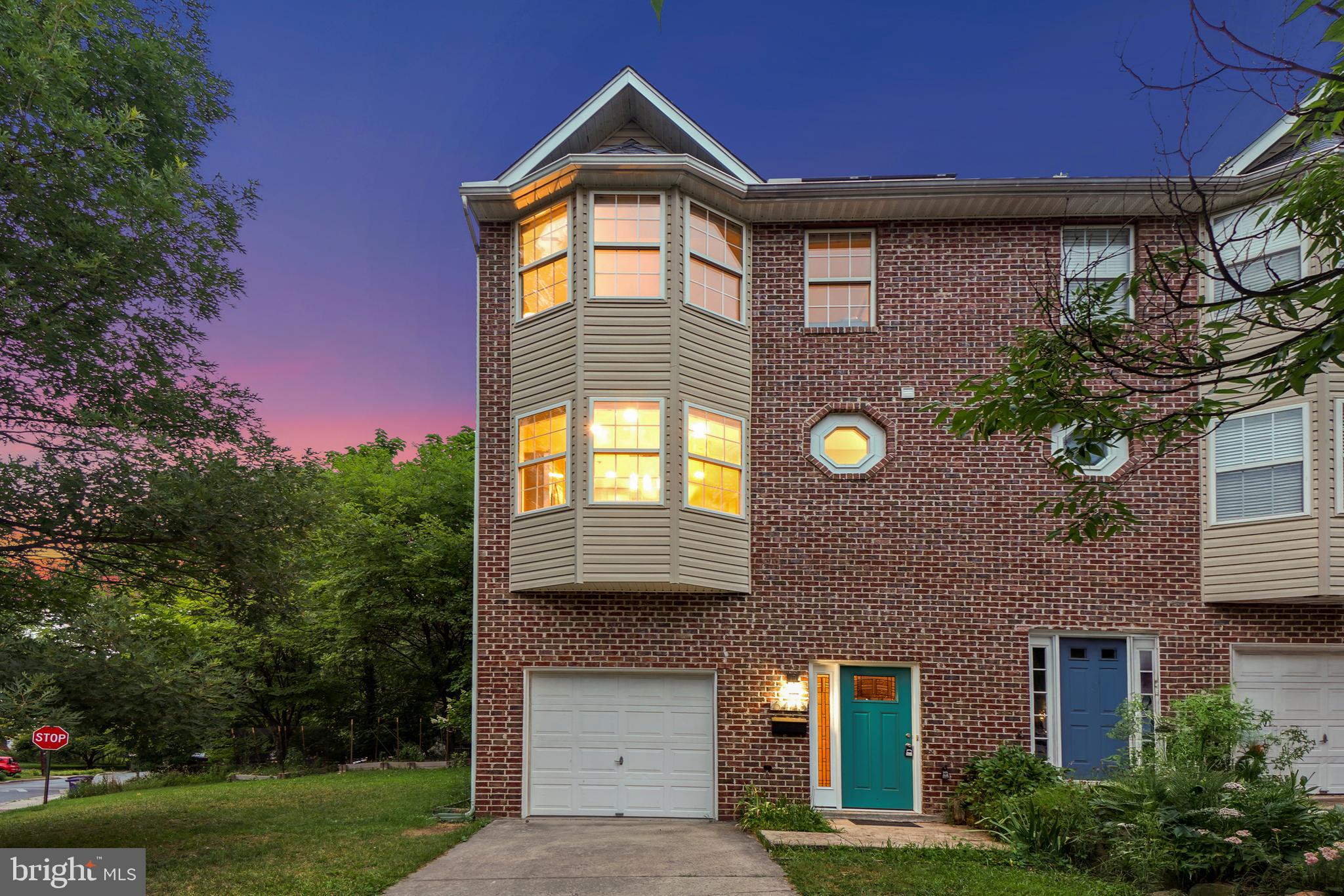Nestled along the scenic Sligo Mill Neighborhood Conservation Area, this beautifully renovated end-unit townhome offers peaceful wooded views, an exceptional sense of privacy, and nearly 2,000 square feet of thoughtfully designed living space. Built in 2000, and subsequently thoroughly renovated, this three-level home features four bedrooms, three full bathrooms, a powder room, an open-concept floor plan, inviting outdoor living spaces, an attached garage, and no HOA.

Designed for modern living, the sun-filled main level showcases an open-concept layout enhanced by hardwood flooring and tasteful finishes throughout. The spacious living room is accented by a gas fireplace, crown molding, recessed lighting, and direct access to a private deck overlooking the picturesque parkland. The living room flows seamlessly into the dining area and beautifully renovated chef's kitchen, appointed with stainless steel appliances, granite countertops, a center island breakfast bar with a five-burner gas cooktop, a bay window, tile flooring, pantry, and a conveniently located powder room with a porthole window.

The upper level features three bedrooms and two beautifully updated full bathrooms. The primary suite showcases wood flooring, generous closet space with an organizing system, and a charming bay window. Its en-suite bathroom has been tastefully updated with a double vanity and a jetted soaking tub.

The entry level offers direct access to the attached garage, an LG laundry closet, and a private en-suite fourth bedroom with vaulted ceilings and access to the side yard.

Outdoor living is just as inviting, with a private deck off the living room overlooking the wooded conservation area and a backyard that extends your enjoyment of the peaceful setting. The attached garage offers secure parking, a workshop area, and additional storage. Nestled within the Orchard Avenue townhome community, this residence backs to the tranquil 6.5-acre Sligo Mill Neighborhood Conservation Area, an undeveloped parkland managed by the City of Takoma Park. A community garden and playground are just half a block away, and numerous walking trails weave through the neighborhood, fostering a deep connection to nature. Enjoy convenient access to downtown Washington, DC via North Capitol Street, Metro, or bus, along with shopping, dining, entertainment, and the Takoma Metro Station, precisely a mile away!