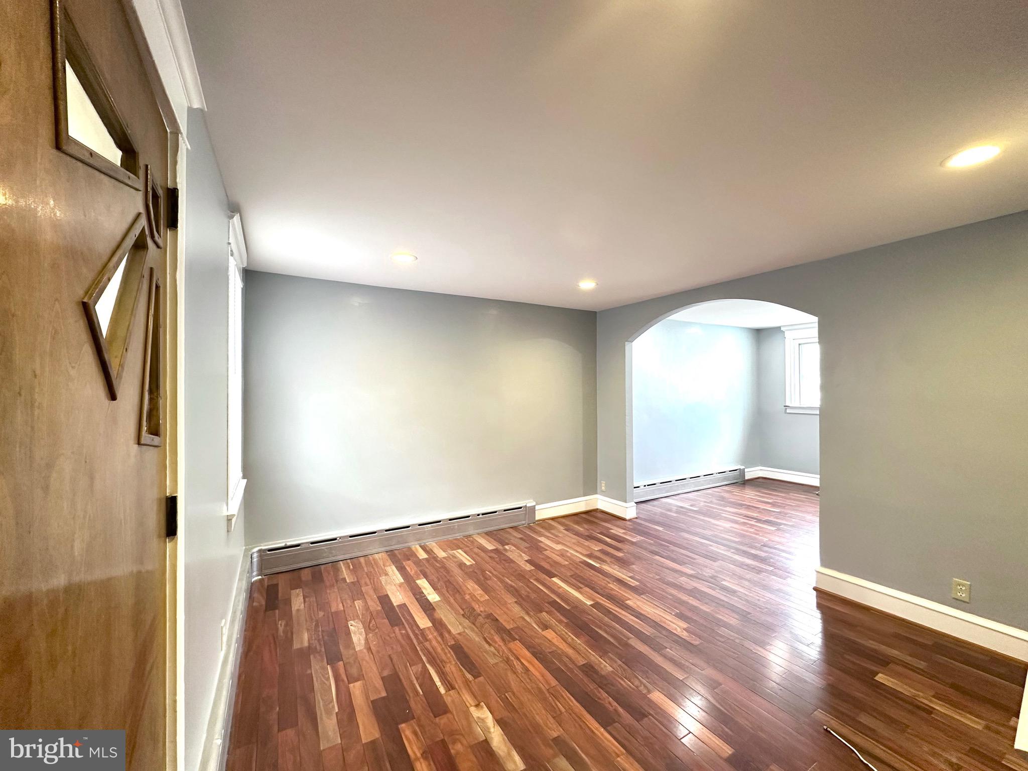 Cozy 2 bedroom with optional 3rd bedroom in basement, 1 bath townhome in quaint neighborhood of Upper Darby.  Move in ready, featuring hardwood and tiled floors, recessed lighting, hot water baseboard heating, private parking with fenced yard and well maintain fenced porch. The walkout  basement features  fully tiles floors, the third bedroom with ample closet space and  laundry hookup. Located conveniently near local transportation to take you to the city or surrounding suburbs!