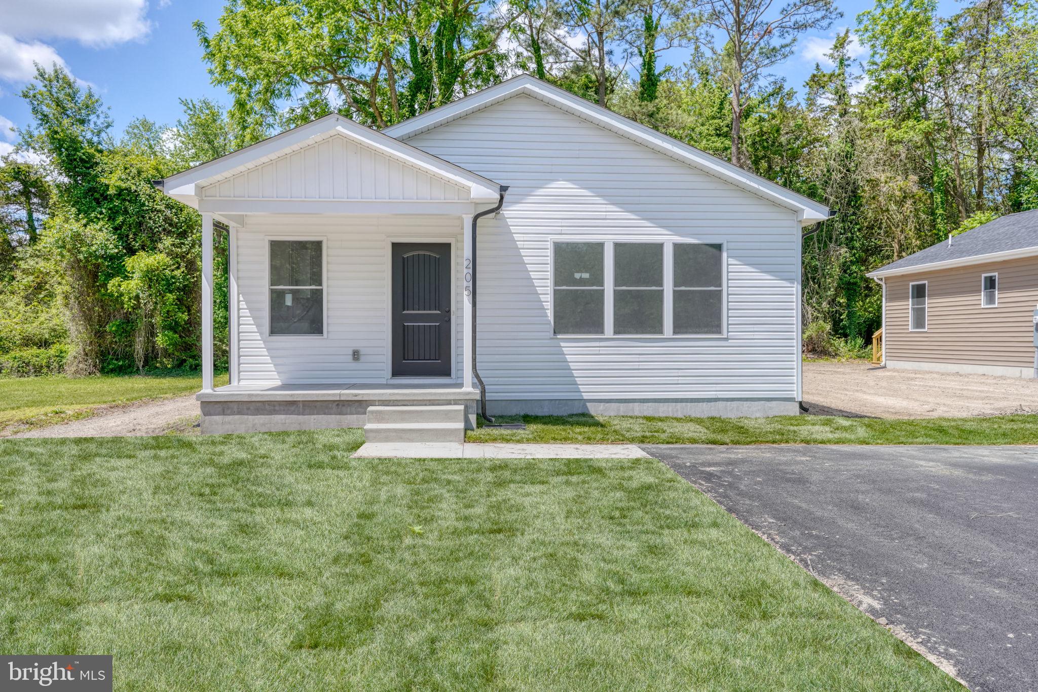 Welcome to 205 Charles Way — brand new construction and ready for its first owner! This beautifully finished 3-bedroom, 2-bath home offers a convenient in-town Georgetown location on a side street with no through traffic and no HOA.

Step inside to an inviting open floor plan filled with natural light, featuring LVP flooring throughout, ceiling fans, soft-close cabinets and drawers, granite countertops, and stainless steel appliances. The spacious primary suite includes a walk-in closet and sliding glass doors leading to the back deck. You’ll also enjoy the covered front porch, generous laundry area, and tasteful modern finishes throughout.

Located close to all the local events Georgetown has to offer, this home is just a short stroll to The Circle and close to restaurants, shopping, and everyday conveniences. Plus, you’re less than 20 miles from Delaware’s resort beaches, making it easy to enjoy the best of both in-town living and coastal Delaware.

Eligible for 100% financing and move-in ready, this home is a wonderful opportunity for buyers looking for new construction with convenience, style, and affordability.