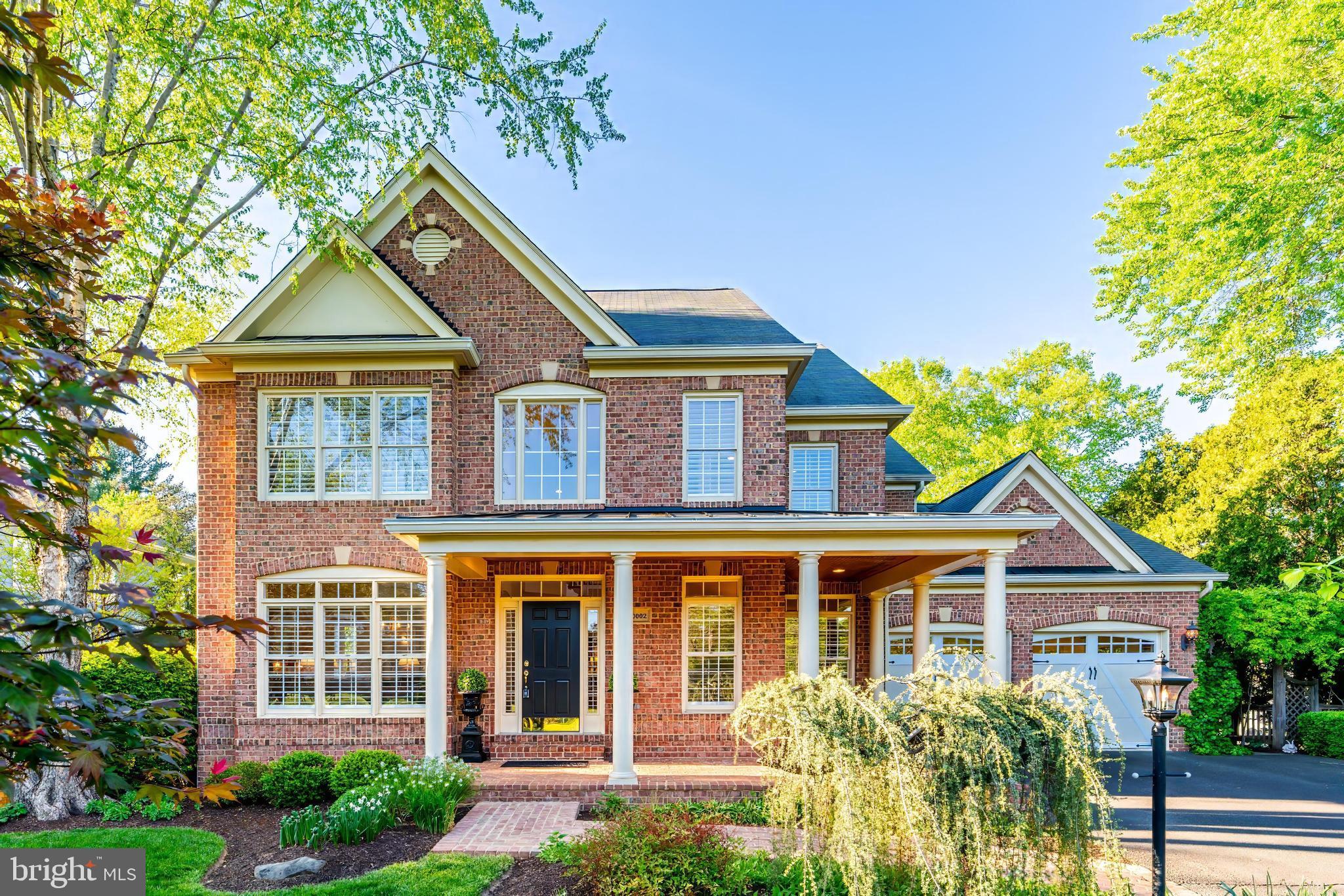Fall in love with this stately, custom brick home sited on a premium half-acre lot with a heated in-ground swimming pool in desirable Little Vienna Estates. This home is a perfect blend of luxury, comfort, and thoughtful design. Graced with a manicured lawn and professional landscaping, the three-sided brick exterior is highlighted with grapevine joints and is complemented by HardiePlank siding at the rear.  A brick walkway welcomes you onto a charming wrap-around front porch, and the over-sized garage and driveway offer ample space for storage and guest parking. 

This exceptional and well-maintained property boasts over 5,000 square feet of living area, an abundance of large windows flooding the space with natural light, and wood floors on 3 levels. Once inside, architectural features abound with a two-story foyer, and a turned, split staircase, tray ceilings, transom windows, custom moldings, arched openings and rounded drywall corner beads. Evoking a casual elegance, there is a fluidity between the rooms, offering both private family/guest spaces as well as areas for informal get-togethers. The main level features an open concept kitchen and family room with cozy fireplace and a 10’ high ceiling. Step outside to discover an inviting screened-in porch with a vaulted, bead board ceiling and an expansive composite deck with upgraded railings and stairs to the ground level. The main level provides flexibility with a living and dining room that can accommodate a large group or dinner party as well as a convenient home office that could also serve as a den or music room. The upper level is thoughtfully designed with 4 bedrooms (each with an ensuite bath) and a roomy walk-in laundry room. The beautiful primary suite offers a spacious sitting area, fireplace and 2 walk-in closets.  The recently renovated primary bath is the epitome of luxury with elegant marble tile, a frameless shower, soaking tub, dual sink vanity, separate makeup vanity and water closet. Wood floors, ceiling fans and generous closet space grace all secondary bedrooms, ensuring comfort and convenience for all. 

The light and bright walk-out lower level is ideal as an in-law or nanny suite with a 5th bedroom and ensuite bath. The lower level is enhanced by a large great room with patio access and an adjacent media room with wet bar which create a fantastic living and entertaining experience for those who cherish gatherings with family and friends. This flexible floor plan also features a game room that could easily serve as an exercise area and there are 2 additional separate storage rooms with potential as a 2nd laundry room and/or a wine cellar.

The private, fully fenced back yard is a welcome oasis and steals the show with its beautiful surroundings complete with a gas-heated, roman shaped 20’x40’ gunite pool, lighted and designed with rounded walk-out stairs and two swim-outs near the jumping board.