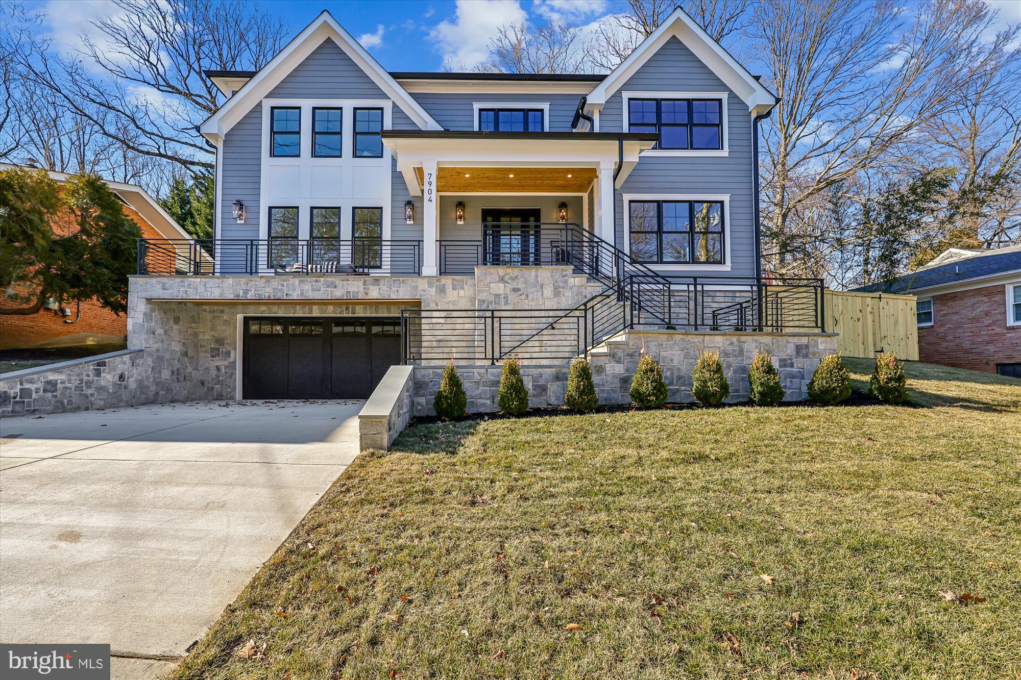 Welcome to 7904 Rocton Avenue built by esteemed builder ERB Properties! This stunning home offers an amazing open floor plan with 3 finished levels, 6 bedrooms, 6 bathrooms and over 5,300 square feet of living space! Featuring beautiful craftsmanship and custom finishes with generous-sized rooms, abundant recessed lighting and wide plank hardwood floors, it is ready for you to move right in! The main level includes a living room, formal dining room, butler’s pantry and a gourmet chef’s kitchen with high end appliances, soft close cabinets & drawers, quartz countertops, a  center island and a walk-in pantry. The main level also features a light and bright family room with a gas fireplace, covered porch off of the family room, a bedroom/office and a full bathroom. The spectacular upper level boasts a relaxing primary suite with two walk-in closets and a luxurious spa bathroom with a separate oversized frameless glass enclosed shower, a soaking tub, two vanities and a make-up counter. Also on the upper level are 3 additional bedrooms, 3 additional full bathrooms, an inviting family/homework-study area and a laundry room with a sink, cabinets and a washer and dryer. On the lower level you will find a spacious recreation room with a wet bar, a bedroom, a full bathroom, an exercise room with a rubber mat and mirror, a large mudroom with cubbies and a bench and a separate walk-up side entrance. Located in the lovely Dunlop Hills subdivision, this home is part of the Bethesda Chevy Chase High School cluster.
