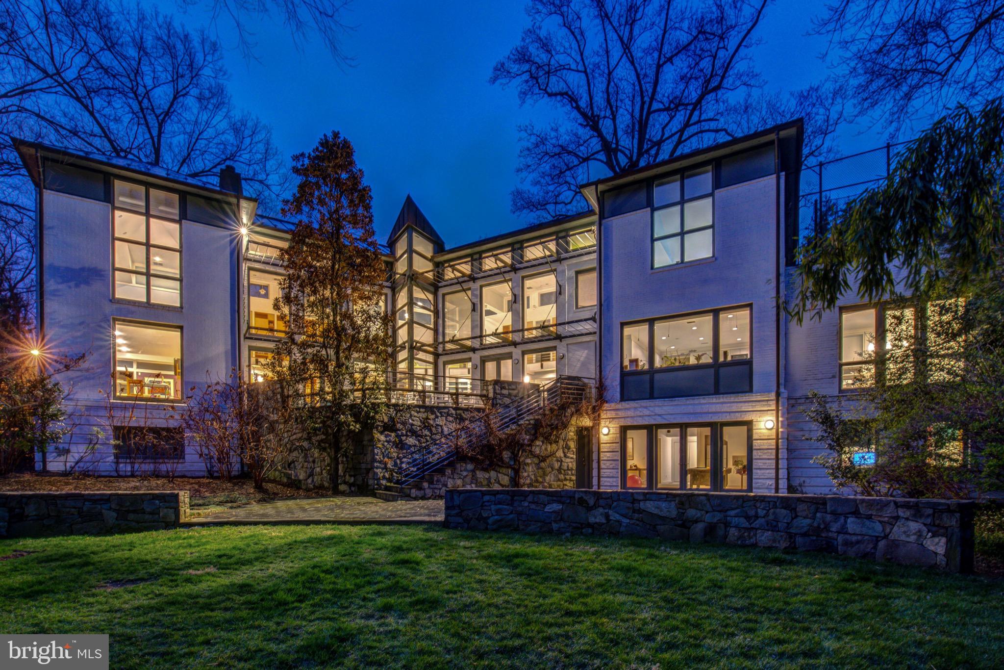 STUNNING Forest Hills contemporary set on a spectacular 1/2 acre+ lot backing to the woodland grounds of the Hillwood Museum. Over 10,500 SF of bright and airy living space with serene parkland vistas through every window. 7 bedrooms, 7 full baths, and 2 half baths throughout. A great room with 22' ceilings, brand new Bulthaup kitchen/family room with Wolf/Sub-Zero/Miele appliances, a second floor sport court, a luxe master suite with 2 en suite bath/dressing rooms, a main level guest suite, and a 2-car garage and mudroom are just some of the many noteworthy features. Fabulous location in quiet yet super convenient Forest Hills enclave with easy access to Rock Creek Park & Connecticut Avenue and walkable to multiple Metros, shops, & restaurants!  NOTE:  PHOTOS IN THE VIRTUAL TOUR AND INDIVIDUAL PHOTOS IN MLS THAT SHOW FURNISHED ROOMS ARE VIRTUAL STAGING ONLY.