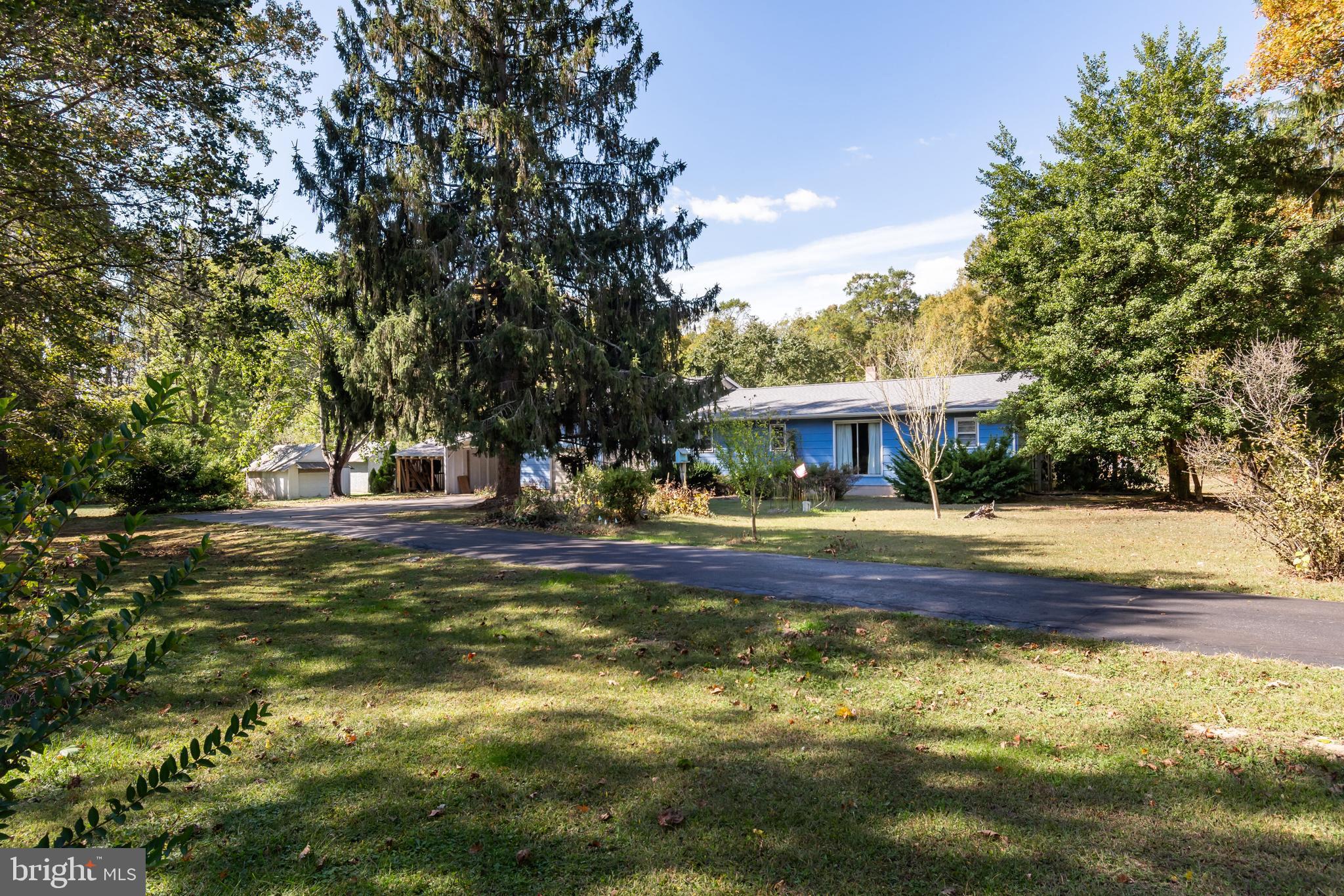 If you are interested in living off the grid and/or a hunter, then this 38+/- acre property might be your ticket!  Gated entrance with a black topped driveway and parking area.  There are several outbuildings including a 60' x 30' pole barn with stairs to second level storage.  Area over the two car garage could possibly be additional living space.  Part of the property is being farmed and is currently planted with soybeans and the rest mostly wooded.  Much of the interior of the house is incomplete.  You will need to add your finishing touches however you have a great canvas to work with.  If privacy is what you are looking for then look no further!!