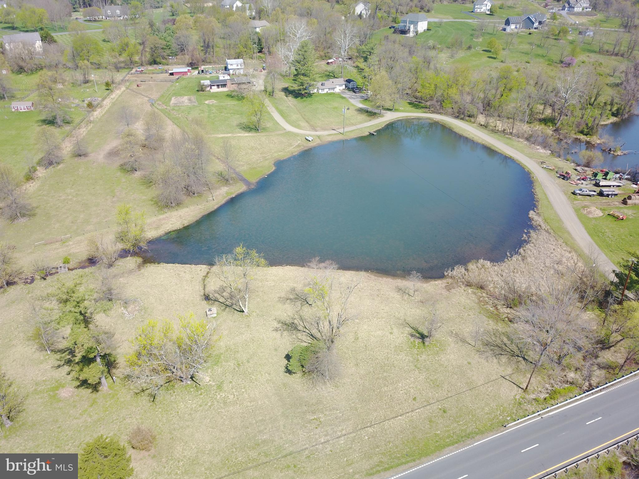 This unique property offers three parcels , two single family homes, one garage with an apartment above, large private bass pond and a nice working barn with fenced pasture land all on over 9 acres of land. Perfect for a family compound, investors looking for rental income or a fix and flip opportunity. Priced below county assessed value. The homes need some TLC and renovation  work which make this property a good opportunity for the do-it-yourselfer. Conveniently located just off Rt. 7 adjacent to the town of Round Hill limits.