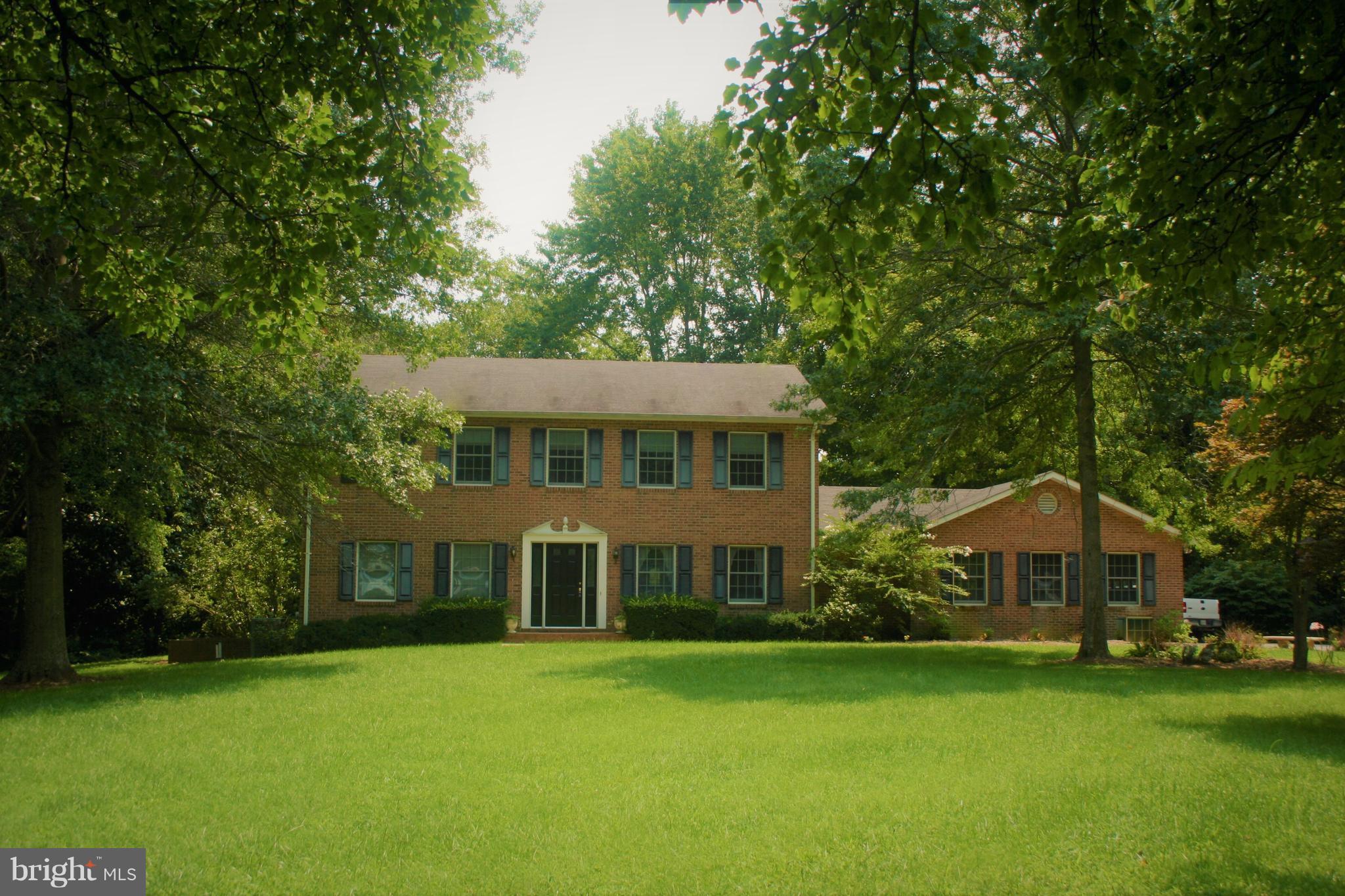 Come see this amazing new listing. All Brick, Custom built 4 beds 2 1/2 baths. 2 car garage. On 3 acres. NO HOA Tennis/basketball court. Backs to forest. Private yet still centrally located. 16ftX40ft screened in porch with skylights. Recently painted/new carpet. Hard wood main floor. Large kitchen with Island and updated appliances.3 tax records 0502072068, 0502144417, 0502144409