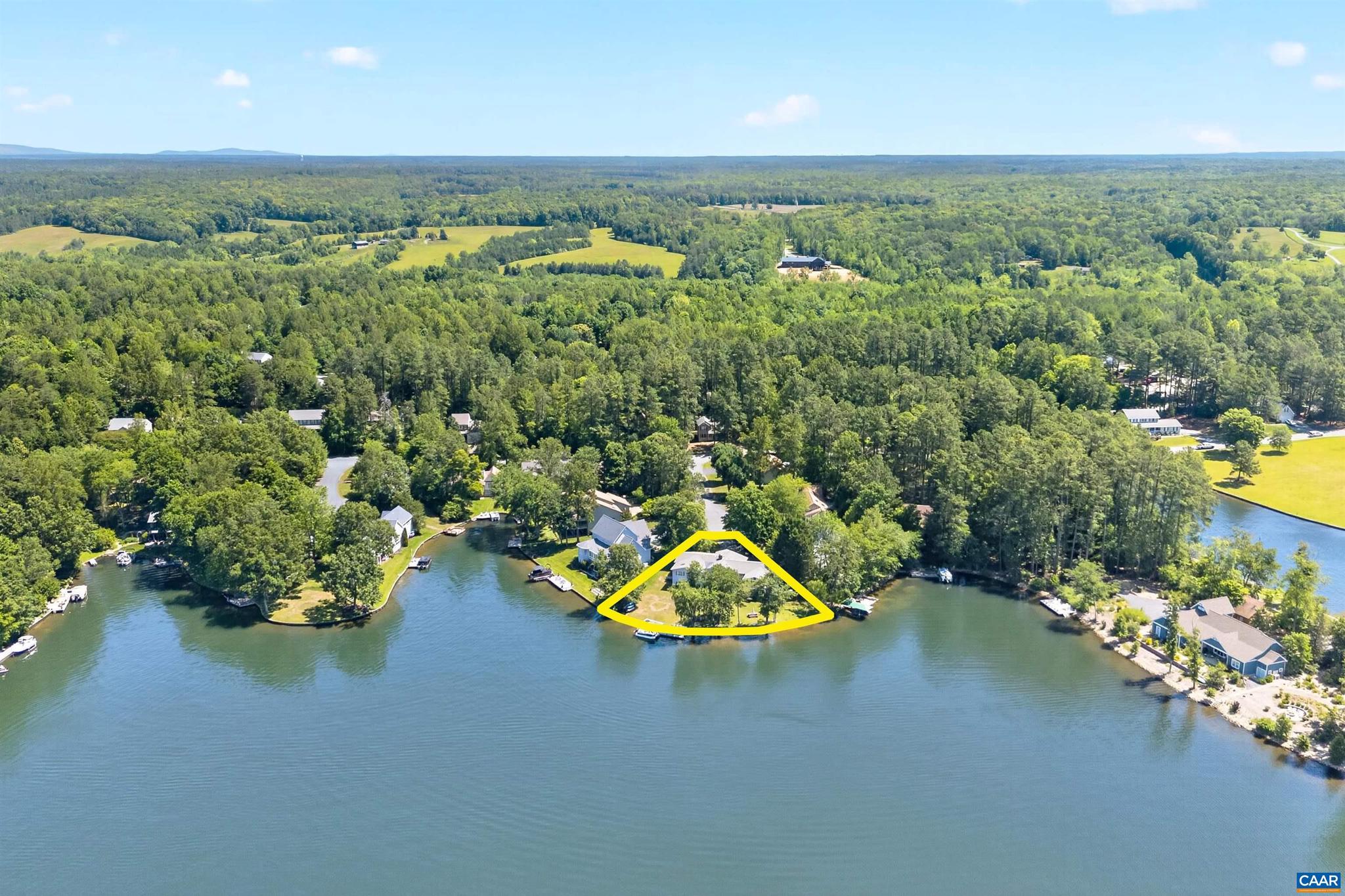 Your Key to the Lake Is Waiting! Come discover this Renovated, Spacious Waterfront Dream Home that is situated on an oversized lot w/over 200' of deep waterfrontage & boat dock.  Level walk from the house directly to the Waters Edge.  Designed for both entertaining & quiet relaxation w/expansive views of the lake & sunsets. The heart of the home is the designer kitchen w/Cherry cabinets, granite counters, center island, pantry, tile backsplash, ss appliances.  The open kitchen leads to a large dining area and 16' x 13' Sunroom that is your perfect perch for the Amazing Sunsets.  Relax in your family room w/fireplace, built in bookcases, primary bedroom w/attached bath & sitting area which can be utilized as an exercise or hobby area. 3 addt'l bedrooms on 1st level w/attached baths, bamboo & pine hardwood floors. The finished lower level boasts; Private Accommodations for guests or extended family w/a full kitchen, full bath, 2 bedrooms, laundry & living rm.  There is also a large dedicated area for your workshop w/a private bath.  Unfinished areas for addt'l storage for all those water toys. Attached 2 car garage, & large deck with a gazebo for your family BBQ's. THIS IS TRULY THE BEST PRIME WATERFRONTAGE AT THE LAKE.,Granite Counter,Wood Counter,Fireplace in Basement,Fireplace in Living Room