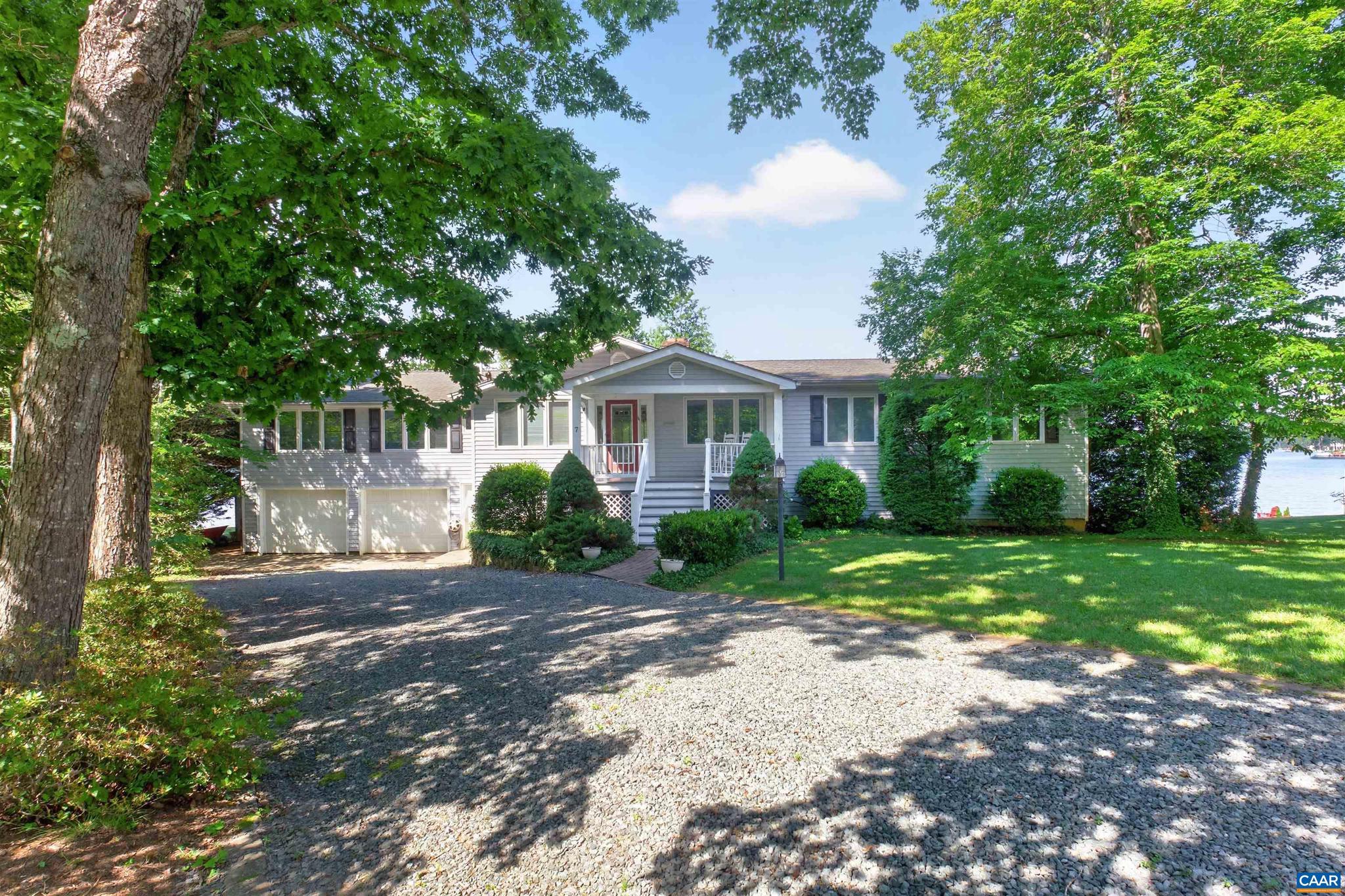 Your Key to the Lake Is Waiting! Come discover this Renovated, Spacious Waterfront Dream Home that is situated on an oversized lot w/over 200' of deep waterfrontage & boat dock.  Level walk from the house directly to the Waters Edge.  Designed for both entertaining & quiet relaxation w/expansive views of the lake & sunsets. The heart of the home is the designer kitchen w/Cherry cabinets, granite counters, center island, pantry, tile backsplash, ss appliances.  The open kitchen leads to a large dining area and 16' x 13' Sunroom that is your perfect perch for the Amazing Sunsets.  Relax in your family room w/fireplace, built in bookcases, primary bedroom w/attached bath & sitting area which can be utilized as an exercise or hobby area. 3 addt'l bedrooms on 1st level w/attached baths, bamboo & pine hardwood floors. The finished lower level boasts; Private Accommodations for guests or extended family w/a full kitchen, full bath, 2 bedrooms, laundry & living rm.  There is also a large dedicated area for your workshop w/a private bath.  Unfinished areas for addt'l storage for all those water toys. Attached 2 car garage, & large deck with a gazebo for your family BBQ's. THIS IS TRULY THE BEST PRIME WATERFRONTAGE AT THE LAKE.,Granite Counter,Wood Counter,Fireplace in Basement,Fireplace in Living Room