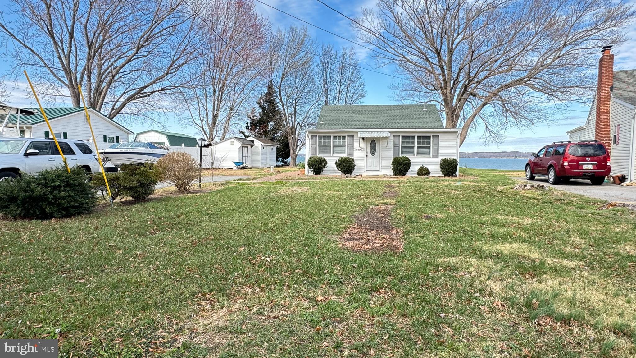 Experience breathtaking panoramic waterfront views of the Patuxent River from this move-in ready retreat! Enjoy direct water access with an existing pier and boat lift, perfect for effortless days on the water. Unwind in the relaxing and calm atmosphere, taking in stunning sunrises and sunsets from your own backyard. Inside, a beautifully designed kitchen awaits, ready to inspire your culinary creations. Don't miss this rare opportunity to own a piece of waterfront paradise!