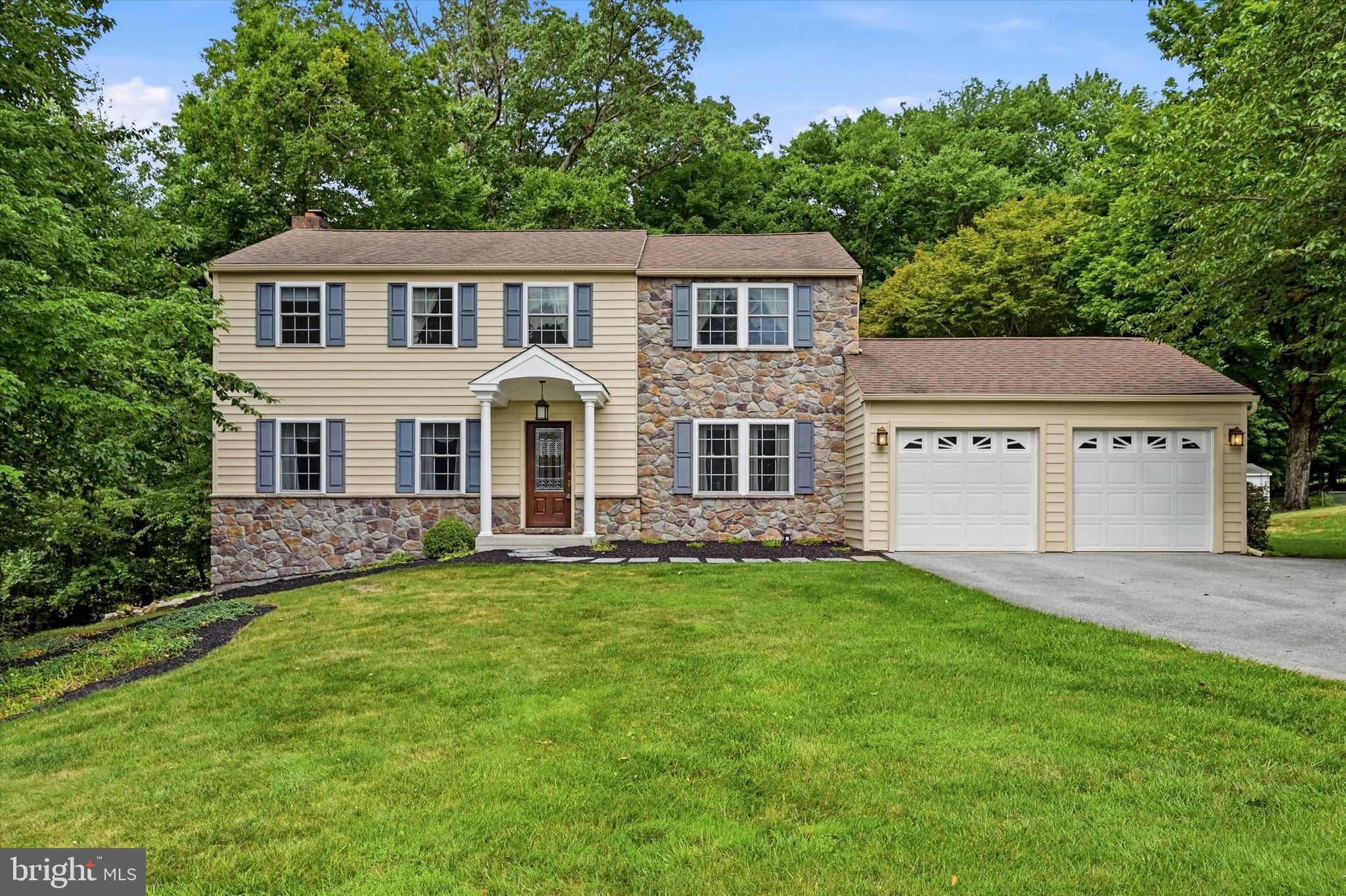 Welcome to 310 Fairview Lane, in the timeless Whitford Hills Community and unbeatable Exton location. From the moment you step inside, you'll appreciate the spacious foyer, where  hardwood flooring creates a warm first impression and carries throughout much of the main level. To one side, the formal dining room is filled with natural sunlight and showcases classic chair rail detailing, an elegant chandelier, and the perfect setting for everything from holiday gatherings to weeknight dinners. The space flows seamlessly into the eat-in area of the kitchen, creating an ideal layout for entertaining. Just off the foyer, the sun-drenched front living room is accented by crown molding and offers incredible flexibility as a home office, playroom, sitting room, or welcoming space for guests. At the rear of the home, the inviting family room is centered around a beautiful brick fireplace and features double sliding glass doors leading directly to the expansive rear deck, creating effortless indoor-outdoor living. The heart of the home is the spacious kitchen, thoughtfully designed with crisp white cabinetry, neutral countertops, recessed lighting, coordinating appliances, a large center island with seating, an oversized pantry, and a convenient built-in secretary station perfect for keeping daily life organized. Just beyond the kitchen, you'll find a powder room along with an oversized laundry and mudroom offering a utility sink, abundant countertop workspace, extensive storage, close garage access, and an exterior door to the backyard—making everyday living as practical as it is comfortable.  Upstairs, a generously sized hall closet provides additional storage, while the hall bathroom features tile flooring and a tiled tub/shower surround. The spacious primary suite serves as a peaceful retreat with a private ensuite bath complete with a walk-in shower and an oversized walk-in closet featuring custom shelving. Three additional bedrooms offer hardwood flooring, generous closet space, and an abundance of natural light. The lower level expands your living space with a partially finished basement—perfect for a recreation room, media space, home gym, or children's play area—while the unfinished section provides ample room for storage, a workshop, hobby space, or future finishing possibilities.  Outside, you'll discover your own backyard oasis. A massive rear deck, partially covered for year-round enjoyment, overlooks a large, mostly level yard surrounded by mature trees that provide both beauty and privacy. Whether you're hosting summer barbecues, enjoying quiet mornings with coffee, or gathering around with friends and family, this outdoor space was designed to be enjoyed.  Ideally situated in the heart of Exton, you'll love being just minutes from the area's exceptional shopping, restaurants, parks, recreation, major commuter routes, and everything Chester County has to offer. This is the perfect opportunity to enjoy space, convenience, and a wonderful place to call home.