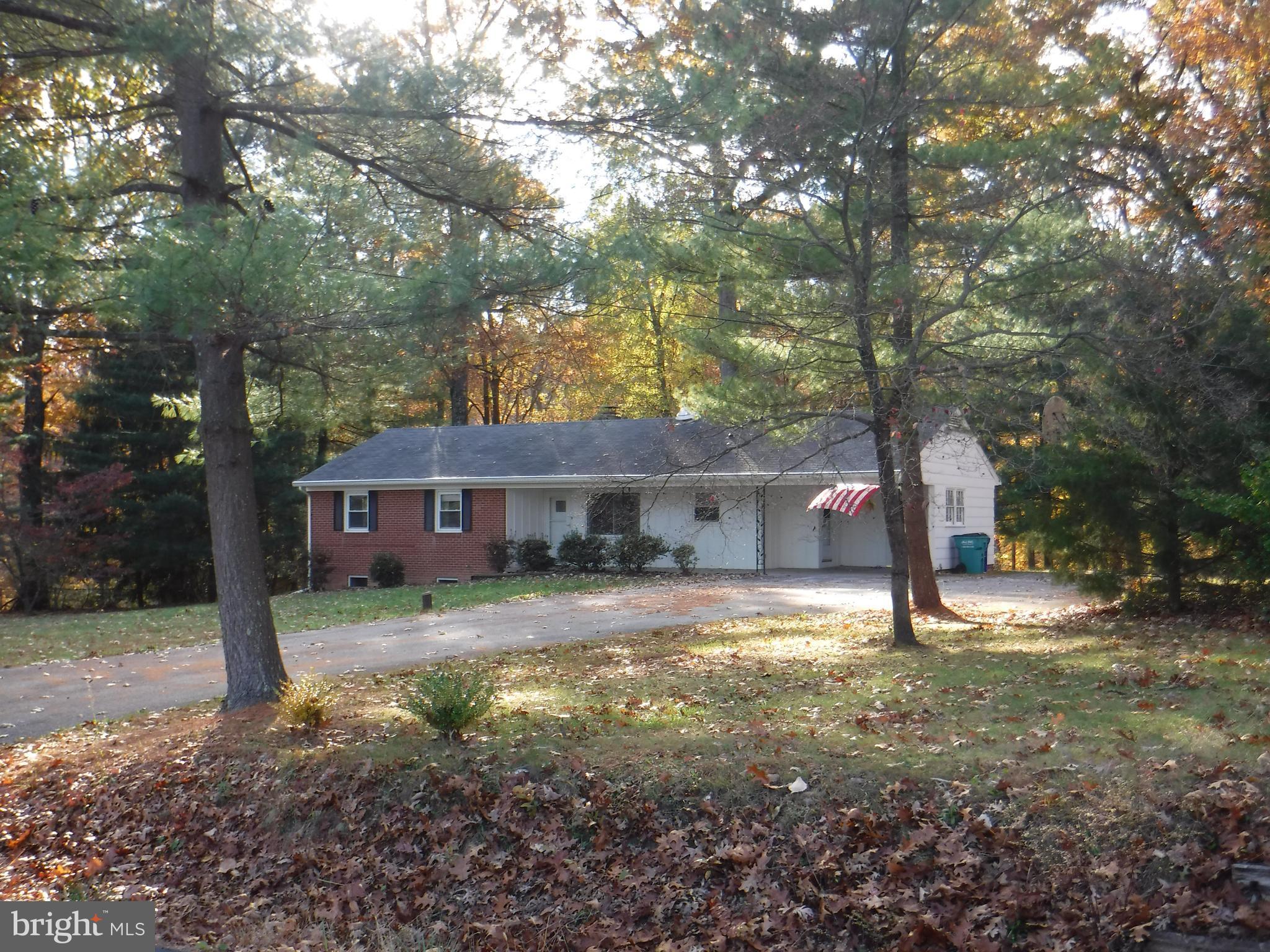 Solid built brick rancher, fantastic commuter location* Gorgeous lot w/ mature trees backing to woodland! Oak flooring main level* Living room w/picture windows,Great views to front & rear! BIG country kitchen* Lower level completely finished HUGE family room & 2nd fireplace. Conv 1st floor laundry & covered front porch. Minutes to MARC, VA, SINGLE FAMILY HOME AT TOWNHOME$$$ WILL SELL QUICKLY!!