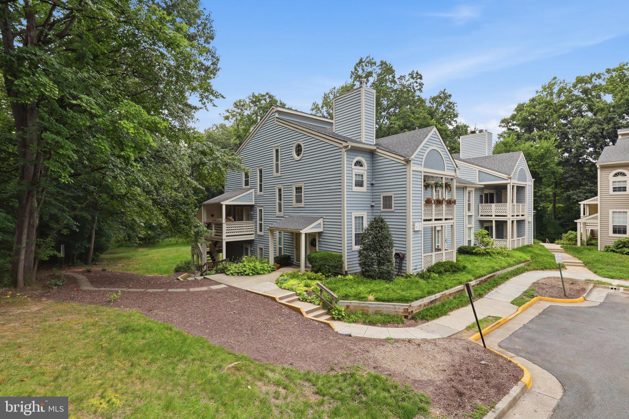 Nestled  just inside the Beltway , this beautifully updated ground-level condo offers the perfect blend of convenience and tranquility. Enveloped by lush, permanent woods, trails and wildlife, the community feels like a private retreat - without sacrificing proximity to everything you need.  Picture the breathtaking views as the leaves turn, or the joy of a snowy morning right outside your door ⛄️ as deer quietly stroll by.
The freshly painted interior showcases  new ceramic tiles in the kitchen,  new gas range  (Chefs, come on over!) , new dishwasher;  new kitchen light, new AC (July, 2026)!  Granite countertop & a large south-facing window that fills the kitchen with abundant natural light. Full-size washer and dryer! Master bedroom boasts  a spacious  walk-in closet with shelving. The open- concept living and dining room combination (extended by the sunroom with triple windows) is anchored by a wood-burning fireplace, creating a warm and inviting atmosphere perfect for both everyday living and entertaining.  A versatile bonus room behind the fireplace serves beautifully as a guest room or private study. Seller will install a door to the space behind the fireplace to make it a second bedroom prior to closing. The generous sunroom offers even more flexible space - perfect for a home office or relaxation retreat. Step onto the west-facing covered patio and enjoy stunning sunsets every evening. All Rooms are virtually staged!
Just steps from your door, Providence Recreation Center awaits with a year-round Olympic-size pool, yoga indoor and outdoor classes, cycling, volleyball or Racketball, saunas and whirlpool. A picturesque 4 acre lake across Jaguar Trail and miles of trails leading to the Fairview Business Center. Conveniently located minutes from Routes 50/66/495 and just a 6-7 minutes drive to Metro and the vibrant Mosaic District with tons of outdoor dining, Target,shops, movies and more .