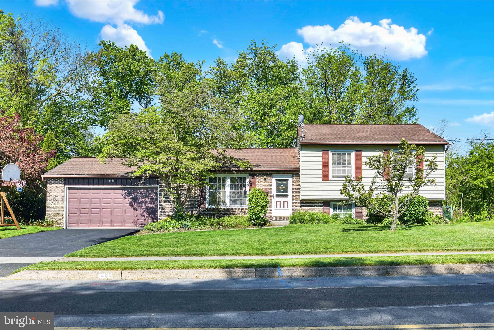 This 4-bedroom, 2.5-bath split-level home is ready for its next owners to make it their own! The main floor offers an easy-flow layout perfect for everyday living. The lower level features an additional living area and extra room that could be used as a bedroom, office, or flex space. Situated on just under an acre, the fully fenced, flat backyard features a beautifully maintained above-ground pool,  just in time for summer enjoyment. Don't miss your opportunity to see all this home has to offer!