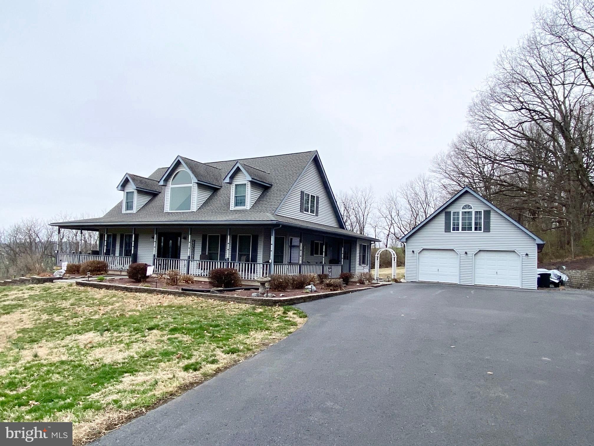 Offers Received! All offers need to be submitted by 4 pm on Monday April 7th!  This well-kept spacious cape cod is ready for new owners!  Located with a rural setting, yet close to Rte 222, Route 183, and within minutes to hospital, stores, and restaurants!  Situated on 4.7 acres, this cape cod has plenty of room for entertaining both on the exterior and on the interior!  The house has plenty of natural sunlight from the large windows and skylights!  The front walkway will lead you to a wrap around porch where you can sit and watch the wildlife and see the beautiful scenery.  As you enter the front door, hardwood flooring will welcome you.  Straight ahead is the living room that has a brick fireplace with pellet stove, hardwood flooring, and vaulted ceilings.  The large kitchen has 2 skylights, island, dinette area, and 38 cabinets.  All the appliances will be remaining! Holiday meals can be served in the dining room.    There are 2 bedrooms on the first floor.  The master bedroom  has 2 skylights, walk-in closet,  and  a slider that leads to the rear deck.  The ensuite consists of a double vanity,  jetted tub (current owner never used), and a shower stall.  The 2nd bedroom is currently being used for an office area.  The  hall bath has tile flooring and walk-in shower.   There are 2 bedrooms on the 2nd level, along with a full bath with double vanity.  Both bedrooms have plenty of storage with the walk-in storage area in the eves.  The daylight finished basement area is phenomenal for your holiday parties!  The double door and full size windows give plenty of natural light.  There is a wet sink kitchenette area, along with a full bath in the basement!  In addition to the finished area, there are additional closets and utility room that allows plenty of storage.  If you like to entertain in the summer, the rear deck and yard are perfect for your parties.  And...for the handyman that needs work area, there is a  detached garage that has full staircase leading to the workshop or storage area on the 2nd floor.  There are even skylights in the garage!  The original heating system for the house was oil, hot air heat and electric baseboard for the basement.  However, the current owners use 2 pellet stoves to heat the house.  And there are approximately 4 tons of pellets included in the sale.  Recent upgrades include 2 new garage door openers, new kitchen refrigerator, 3 new toilets, new chimney cap, fireplace insert.