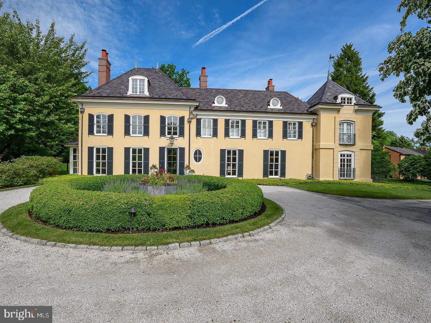 A rare offering in Northside Villanova, this exceptional 1.5 acre French Country estate sits on a premier cul-de-sac, combining privacy, luxury and timeless design. A 2018 renovation blends dramatic floor-to-ceiling windows with an open, modern layout for effortless living and entertaining.  A courtyard entry leads to views of the pool and walled gardens. The chef’s kitchen opens to a spacious great room overlooking the grounds, pool, spa, terraces, and pool house. Features include 5 en-suite bedrooms, 6 full and 2 half baths, and a finished daylight lower level with a gym, bar, media room and wine cellar. 

Professionally designed landscaping, a European-style gravel motor court, Belgian block detailing, and bluestone-capped walls enhance the setting. A Vermont slate roof, copper gutters, detailed millwork, and custom railings complete this one-of-a-kind offering—originally designed by renowned architect Walter K. Durham.