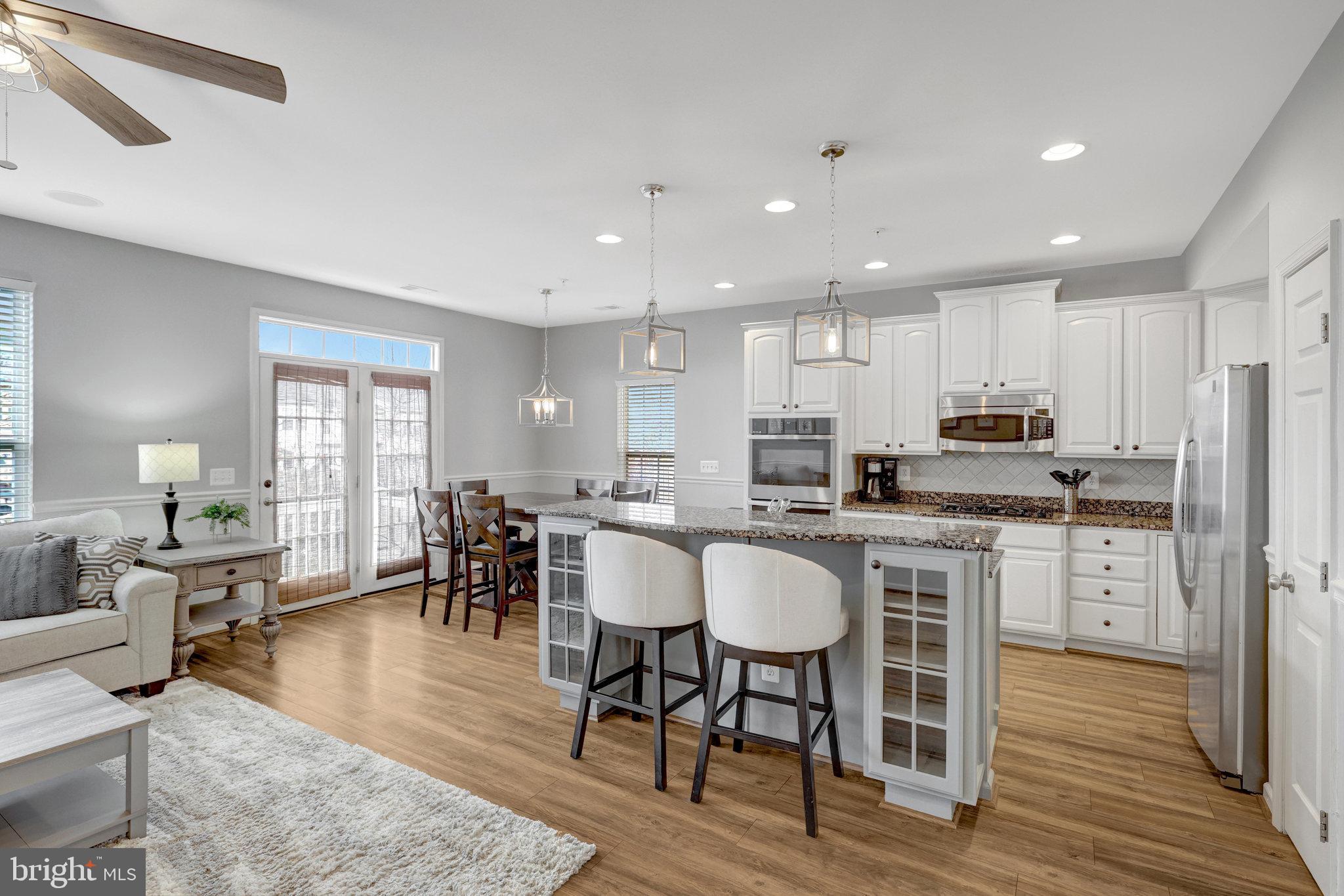 Welcome home to this beautifully updated 3-bedroom, 2.5-bath end-unit townhome in the sought-after Kirkpatrick Farms community of Aldie! With over 2,600 sq. ft. of living space, this home offers the perfect blend of comfort and style.

Step inside to fresh paint and brand-new carpet throughout, creating a bright and inviting atmosphere. The sun-filled living room provides the perfect space to relax, while the spacious dining room is ideal for holidays and family gatherings. The white kitchen cabinetry, new double oven, stainless steel appliances, granite countertops, and upgraded flooring in the kitchen and family room make this space both elegant and functional. The fireplace adds warmth and charm to the open-concept family room.

Upstairs, the spacious primary suite boasts a tray ceiling, two walk-in closets, and a luxurious en-suite bath with dual vanities and a standalone shower. Two additional bedrooms on the upper level provide plenty of space, along with another full bath. The convenient upper-level laundry room includes a sink for added ease.

Enjoy outdoor living with a balcony off the main level, perfect for relaxing with a cup of coffee. The brick facade and one-car garage complete this fantastic home.

Located in an amenity-rich community with tennis courts, basketball courts, fitness center, walking trails, a pool, playgrounds, and more, this townhome is just minutes from shopping, dining, and major commuter routes.