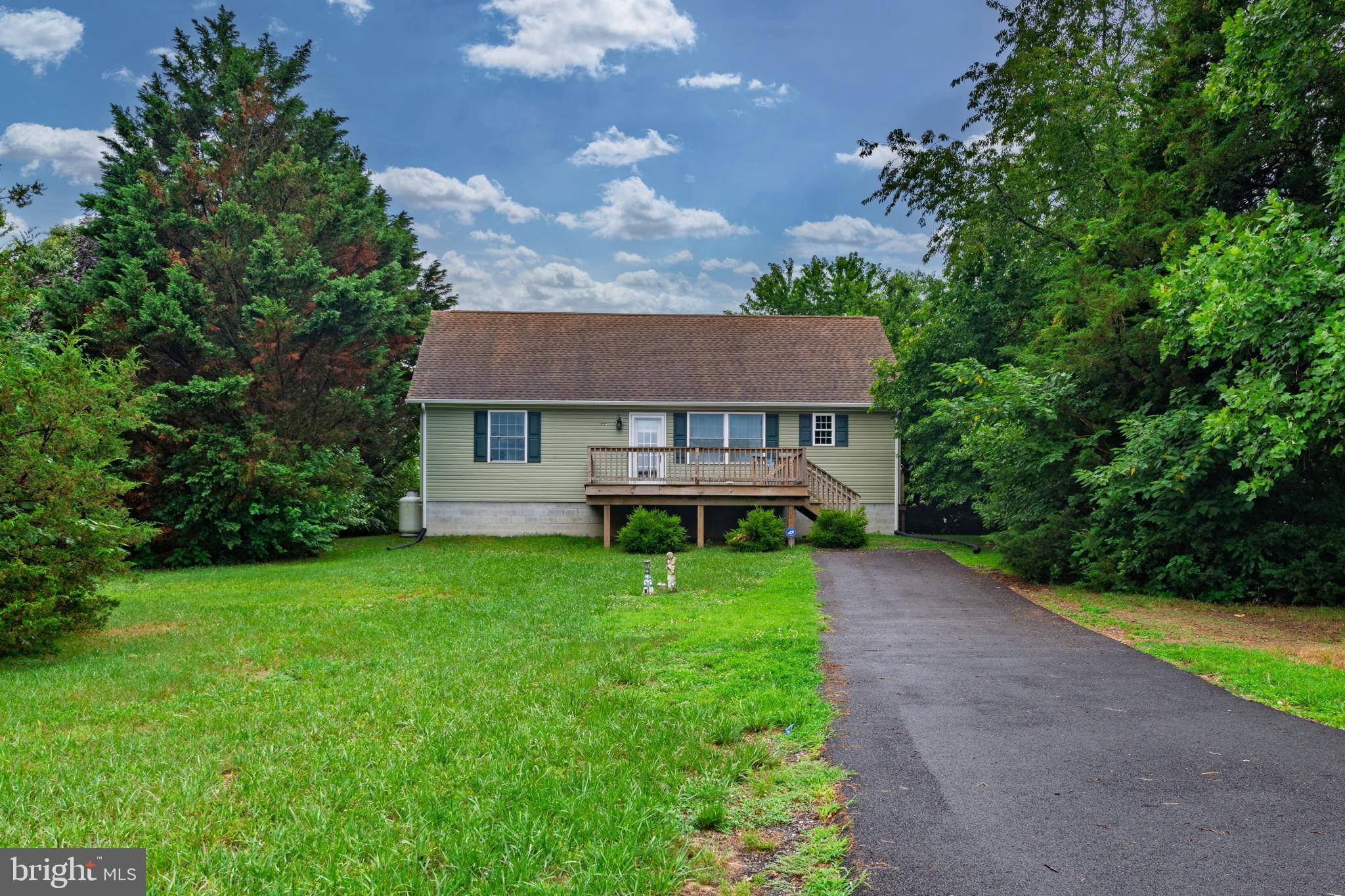 Welcome to Paul Avenue located in the Lewes, Delaware. Built in 2020, this home features 3 spacious bedrooms and 2 bathroom. It sits on a private .42 acre lot that provides ample space for outdoor enjoyment. The home features a large deck with a view of the pond.The open floorpan features kitchen, dining and living room area, great for entertaining. The kitchen includes a gas oven/range, microwave, Bosch dishwasher, range hood, and refrigerator. The washer and dryer are included. Wood floors are featured throughout. The crawlspace is encapsulated with a dehumidifier.  The upstairs is unfinished with insulation, which can be finished for two additional bedrooms. Hot and cold hook up is present for future outside shower. HVAC has central air with forced air gas backup. Overall, this property offers the rare combination of space, comfort and modern features that every homeowner craves. Don't miss the opportunity to make this inviting Lewes, Delaware property your new home. We invite you to come view this gem today! If you looking for a home close to the beaches, be sure to schedule your tour today. No HOA! Home is on well and public sewer.