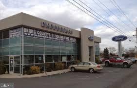 Former Manderbach Ford location on 7+ Acres!  Property includes 1)  27,345 SF Main Building consisting of a)  Showroom (5,318 SF), b)  Mechanics Shop (16,784 SF)  w/ 18' ceilings & 8 drive in doors and c)  Second Floor office/storage (5,243 SF);  2)  Detail Building w/ 6 overhead doors (3,922 SF); and 3)  Body Shop (7,665 SF) w/ 5bays & drivethru overhead doors.   C-3 Commercial Zoning with 586' frontage along 5th St. Hwy.  Acreage/ Buildings can be Divided.  100+ Car Parking.  Lease Possible.
