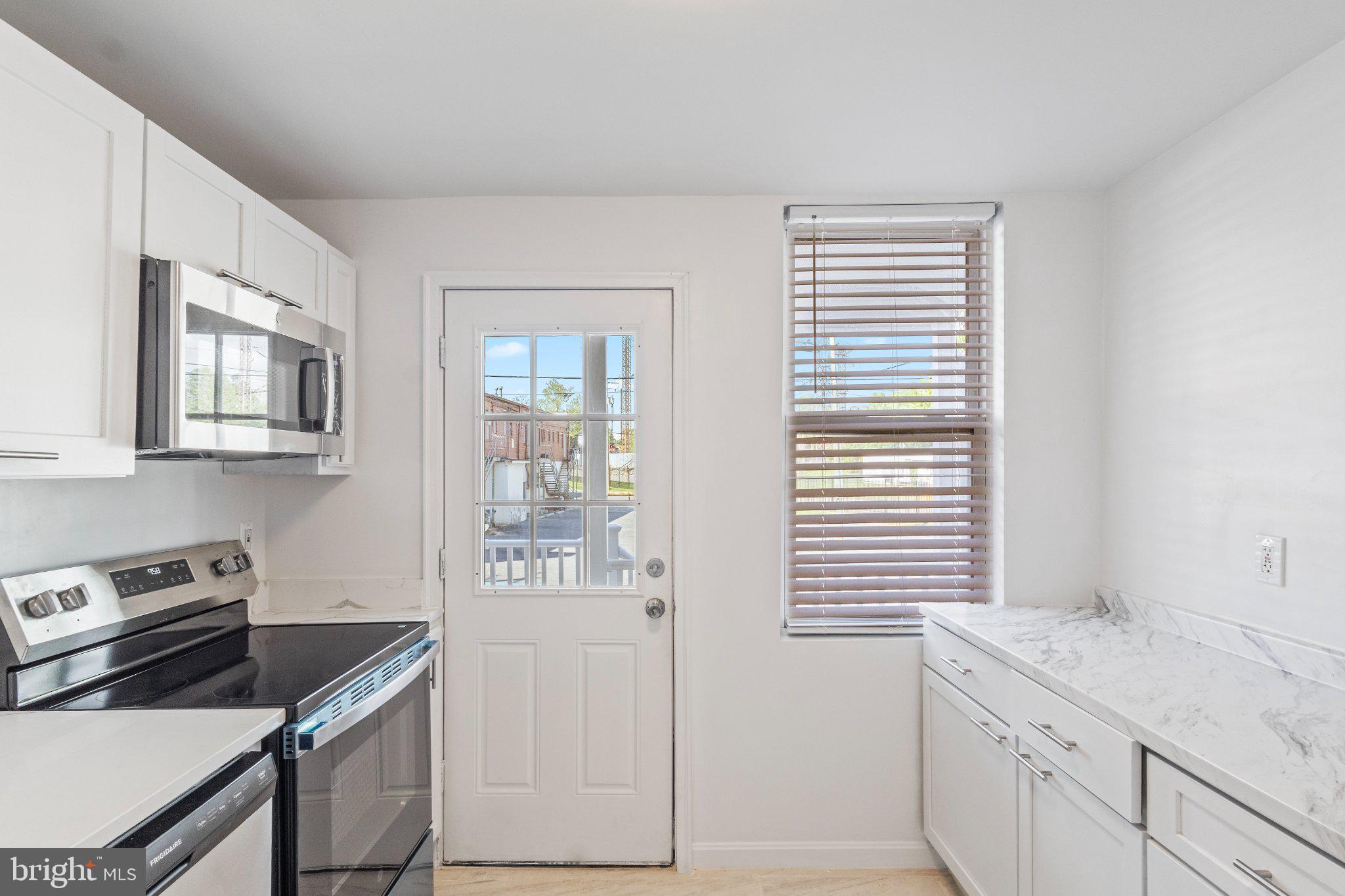 Welcome to this beautifully renovated Baltimore rowhome featuring modern finishes and thoughtful upgrades throughout. This home offers a bright and inviting interior with updated flooring, fresh paint, recessed lighting, and a stylish new kitchen complete with white shaker cabinets, quartz-style countertops, stainless steel appliances, and modern fixtures.The bathrooms have been completely renovated with stunning floor-to-ceiling tile work, upgraded vanities, designer fixtures, and a clean contemporary feel. Spacious living areas and updated finishes throughout.. Conveniently located across the street from St. Agnes Hospital and near major commuter routes, shopping, dining, and local parks make this home perfect for both homeowners and investors alike.