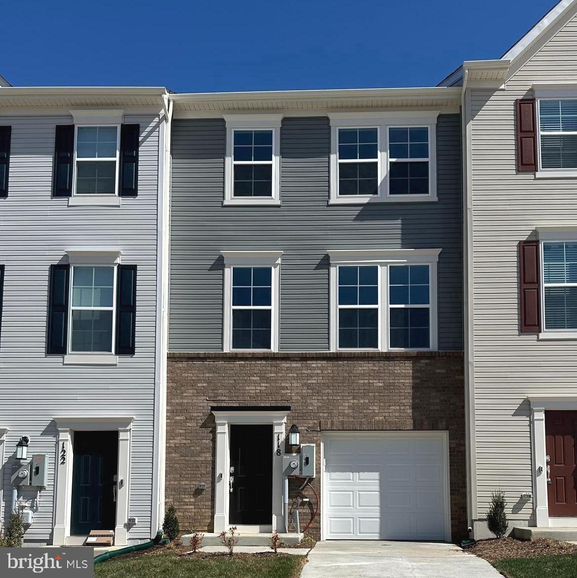 Brand new! Step into this spacious townhome featuring a finished recreation room with a convenient half bath on the entry level — ideal for a home office, workout space, or an additional living area. The main level showcases 9-foot ceilings and modern plank flooring, creating an open and inviting atmosphere. Upstairs, you'll find three bedrooms, two full baths, and a GE washer and dryer conveniently located on the bedroom level, making laundry a breeze. The second floor boasts a multifunctional rear kitchen, a bright great room, a dining area, and a half bath. The kitchen is equipped with GE stainless steel appliances, exterior ventilation, granite countertops, and Barnett Duraform cabinets. Step outside to relax or entertain on the 10' x 18' deck. This home also includes a one-car garage, a Ring Doorbell, and keyless entry for easy and secure access. As a resident, you'll enjoy future amenities like a swimming pool with a bathhouse, green spaces, and a tot lot. Located just moments from shopping, dining, recreation, and the beautiful, historic Shenandoah Valley, this home offers the perfect blend of comfort and convenience. Ready to make the Lancaster townhome your next home? Schedule a tour today. Tawny Zuniga 830-279-9551