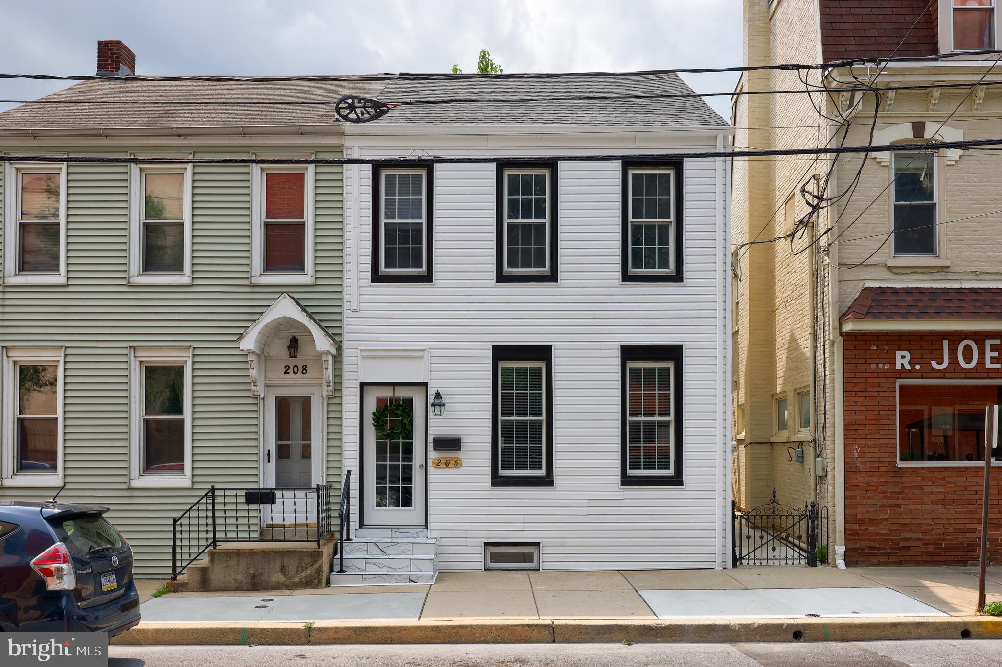 Welcome to 206 S Fourth St - a three story, beautifully remodeled row home located within Columbia Boro. BRAND NEW. Recent, extensive renovation - down to the studs. Plumbing, electrical, mechanicals, kitchen, bathrooms, drywall, lighting, flooring, rear fencing - all new. Even the basement floor was epoxied! 9 ft + ceilings on the first floor, with open feel. Electric fireplace, additional, added half bathroom, and a stunning kitchen including; custom cabinets,  island with room for stools, granite countertops, ceramic tile, and stainless appliances. Enjoy the three, large bedrooms on the second floor, all with brand new carpet, closets, and overhead lighting. Bonus bedroom on the third floor with heat and Central AC! Great access to many Columbia favorites, the River Trail, and Route 30. No other home like it currently listed for sale in Columbia Boro. Open House - Sunday, August 6th from 12-3 pm.